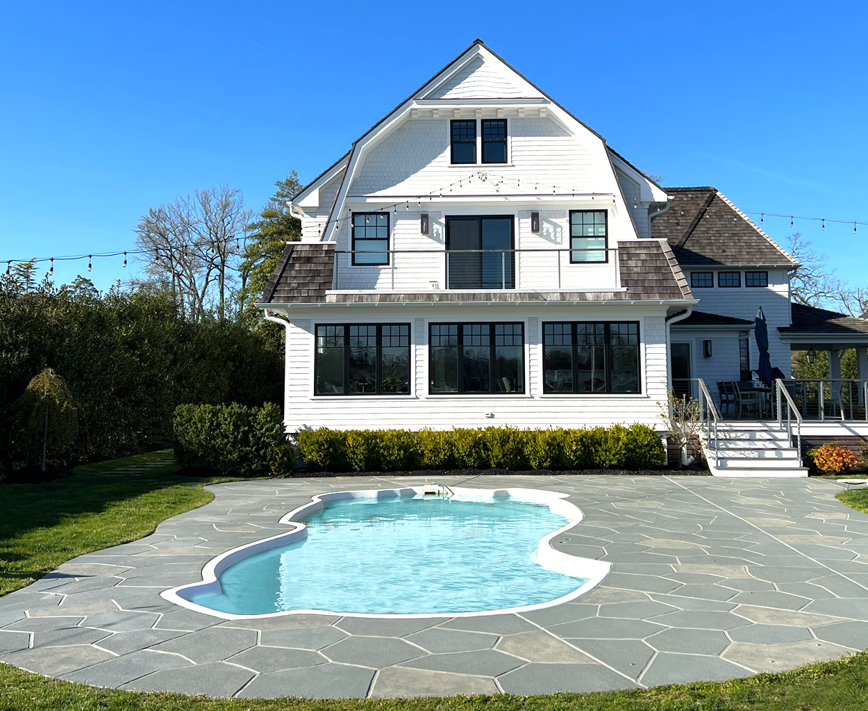 Upgraded concrete pool deck in Granite Slate finish in Marlton, NJ with clean gray slate look.