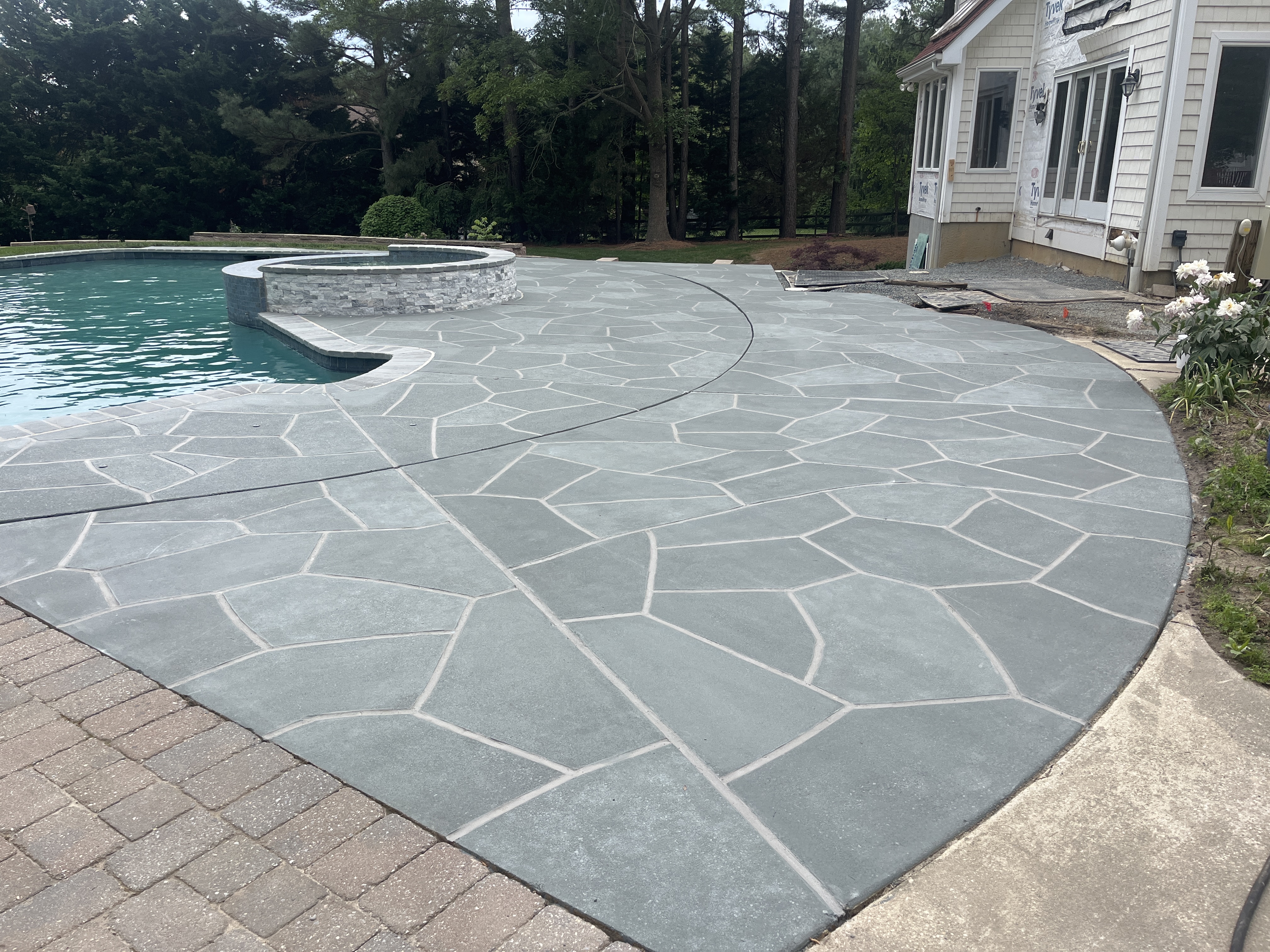 Granite Slate pool deck concrete resurfacing project with refined slate like texture.