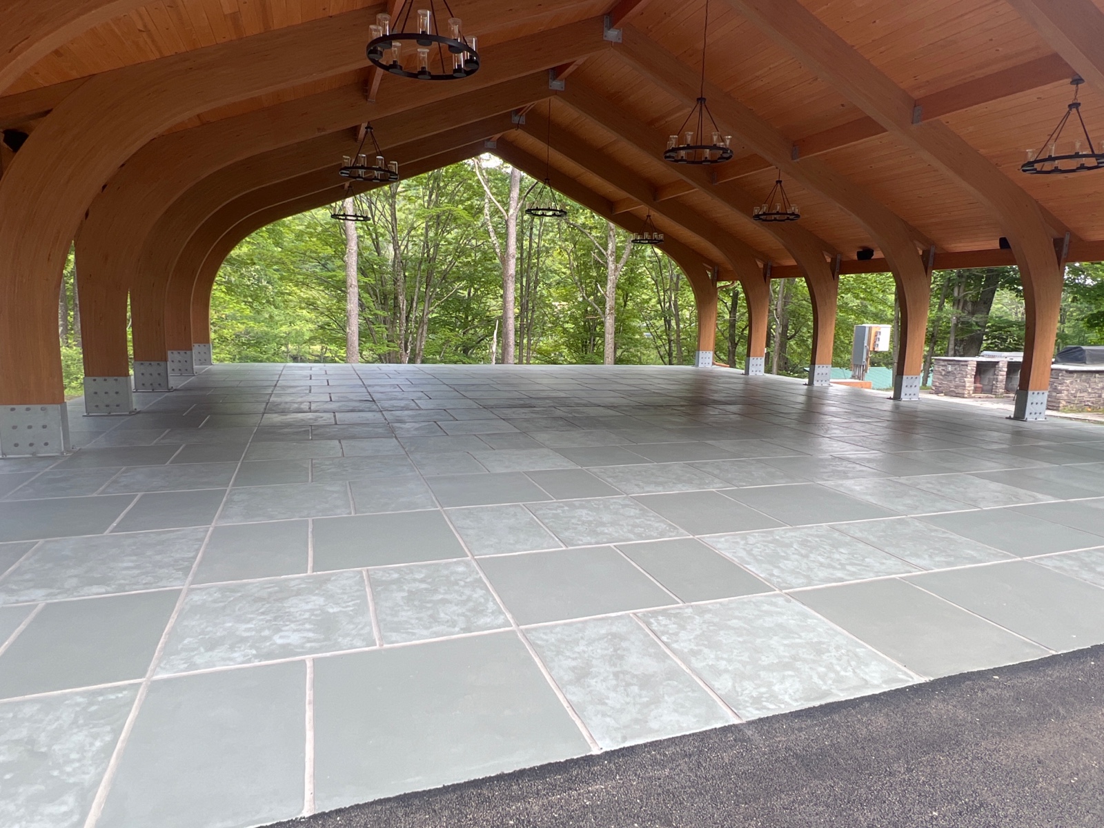 Resurfaced concrete pool deck in Granite Slate finish showing modern gray stone appearance.