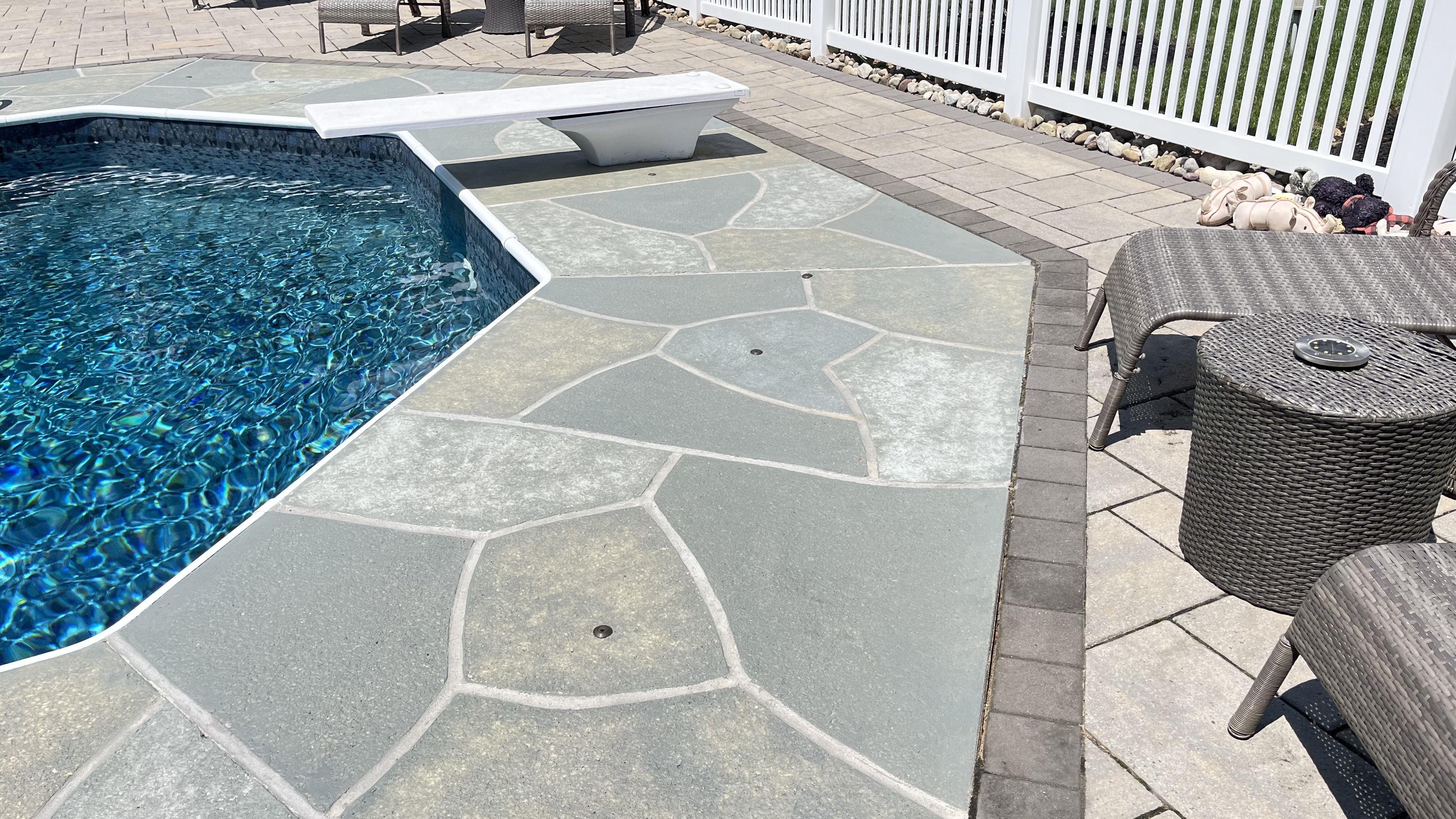 Granite Slate pool deck concrete resurfacing project with refined slate like texture.
