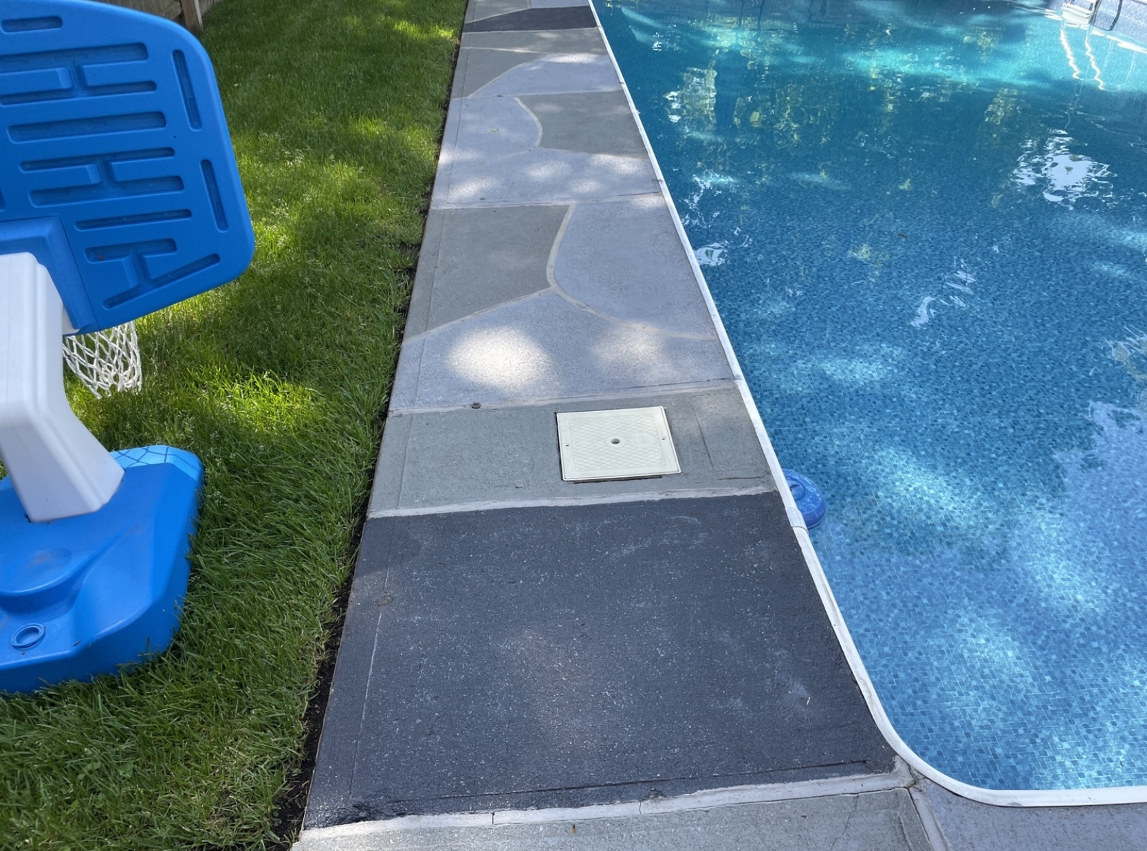 Granite Slate pool deck concrete repair and resurfacing project in Providence, RI.