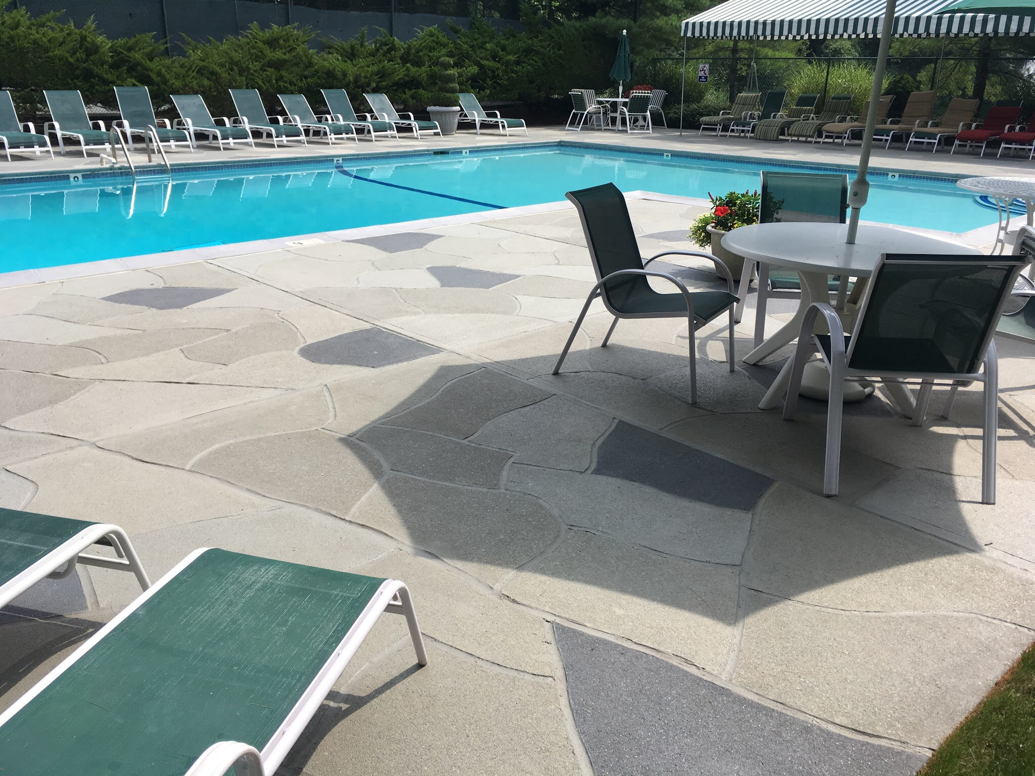 Granite Slate pool deck concrete resurfacing project in Marlton, NJ with refined slate like texture.