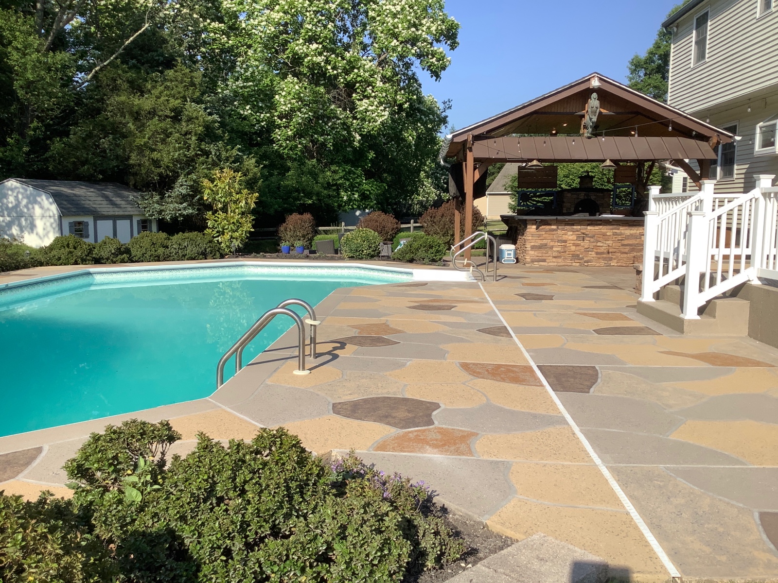 RenuKrete resurfaced pool deck in Hurricane Slate showing textured slate-like pattern