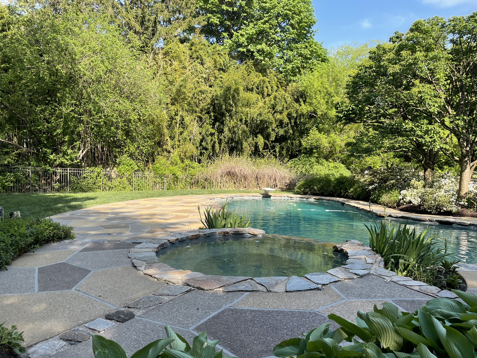Pool deck resurfaced in Hurricane Slate finish with refined surface texture in Plymouth, MA