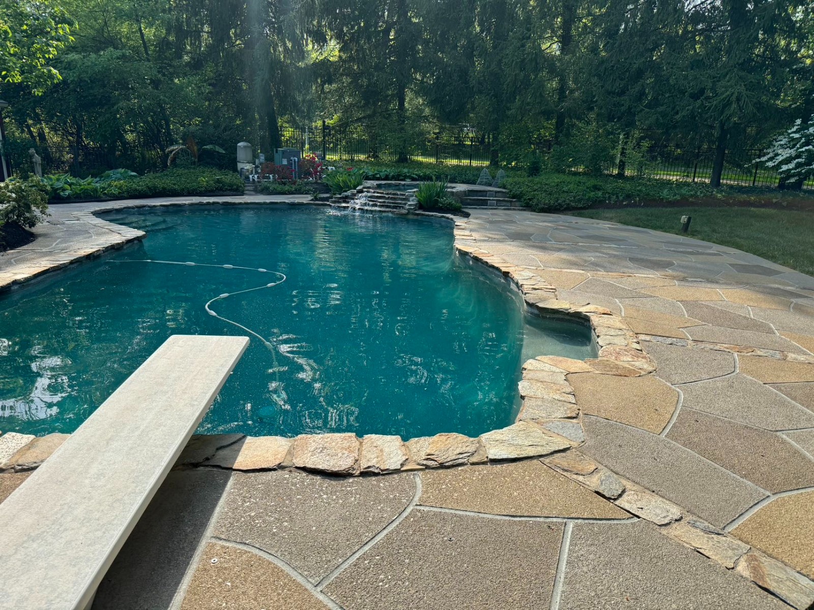 Hurricane Slate concrete pool deck repair featuring deep gray stone tones