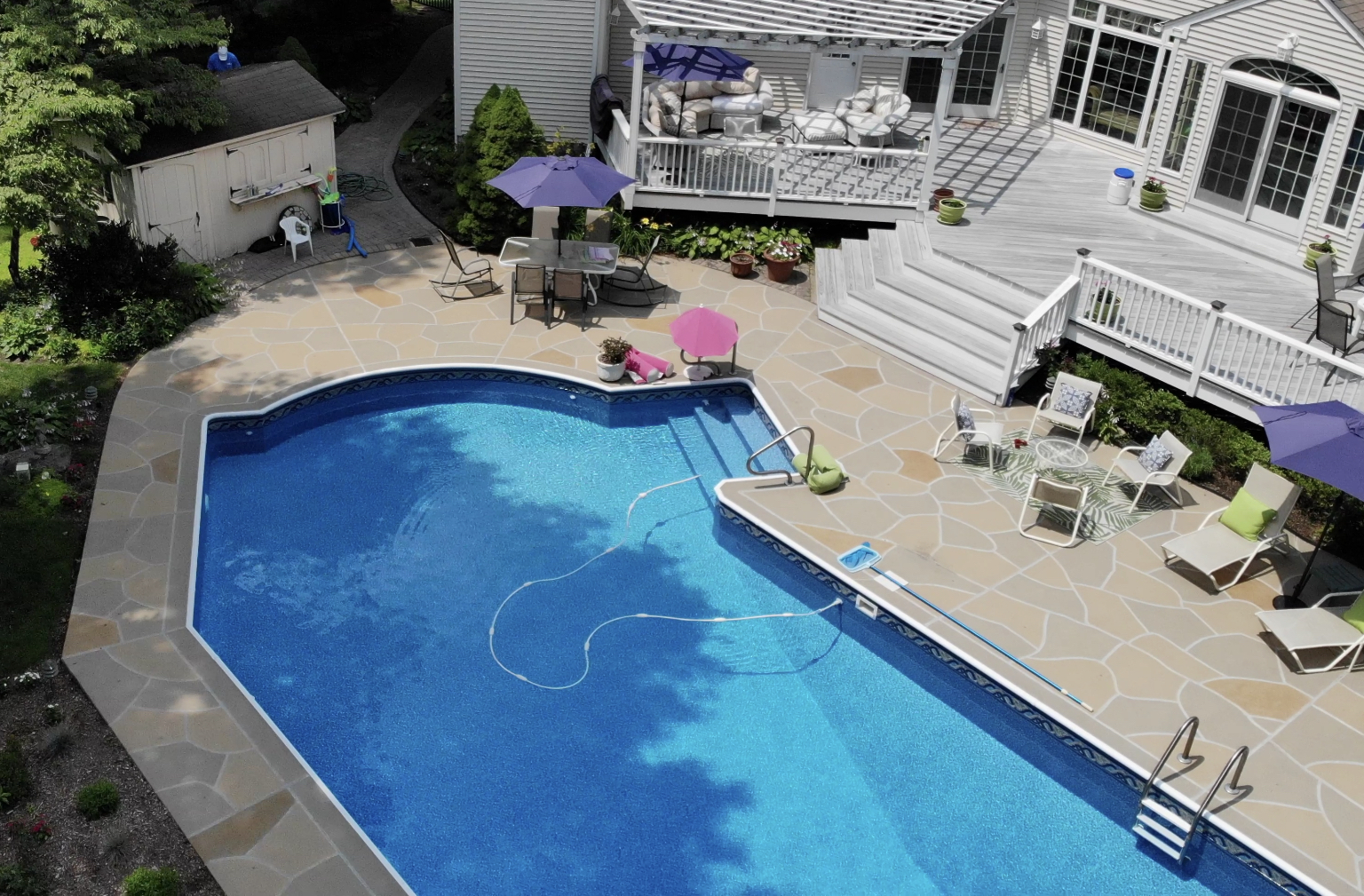Modern Hurricane Slate pool deck renovation displaying durable resurfaced concrete