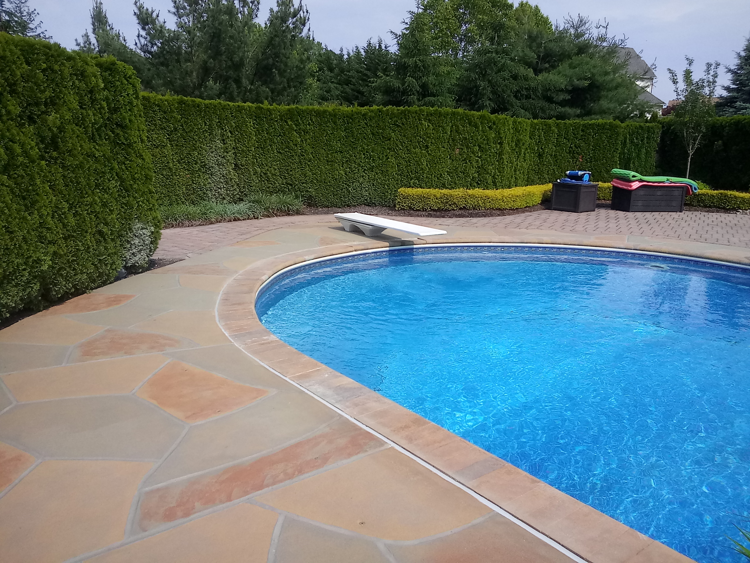 Pool deck resurfaced in Hurricane Slate finish with modern slate-like aesthetic