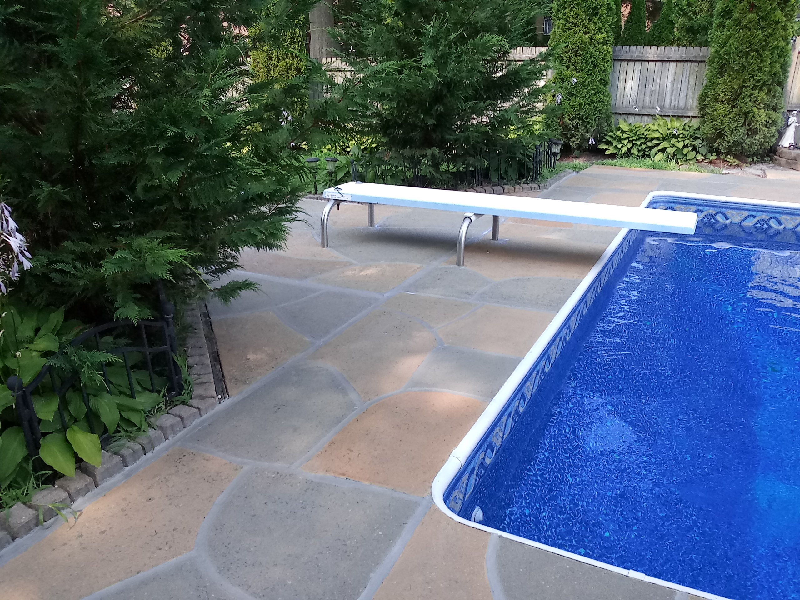 Hurricane Slate concrete pool deck repair featuring durable resurfaced concrete