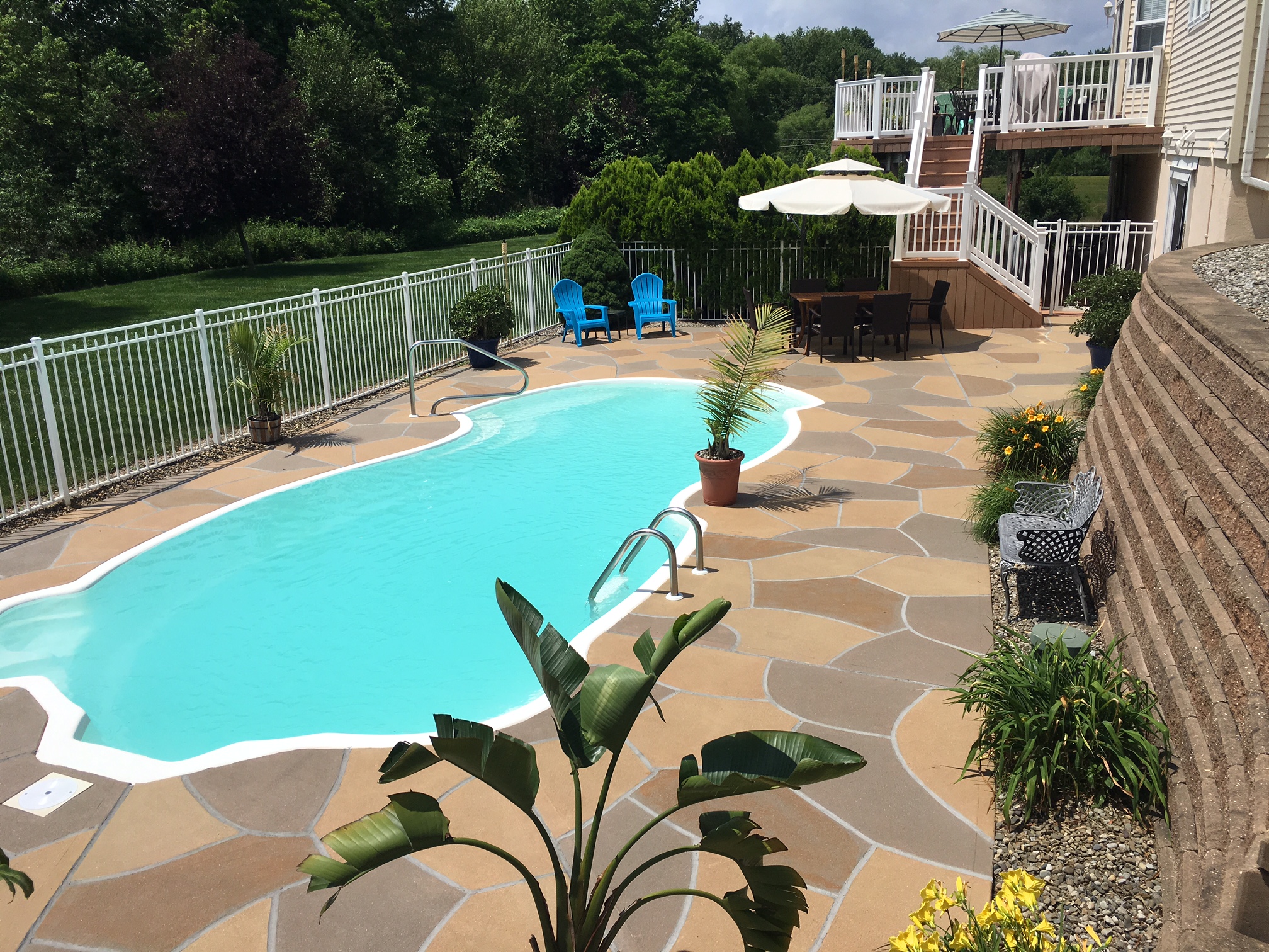 Modern Hurricane Slate pool deck renovation displaying textured slate-like pattern