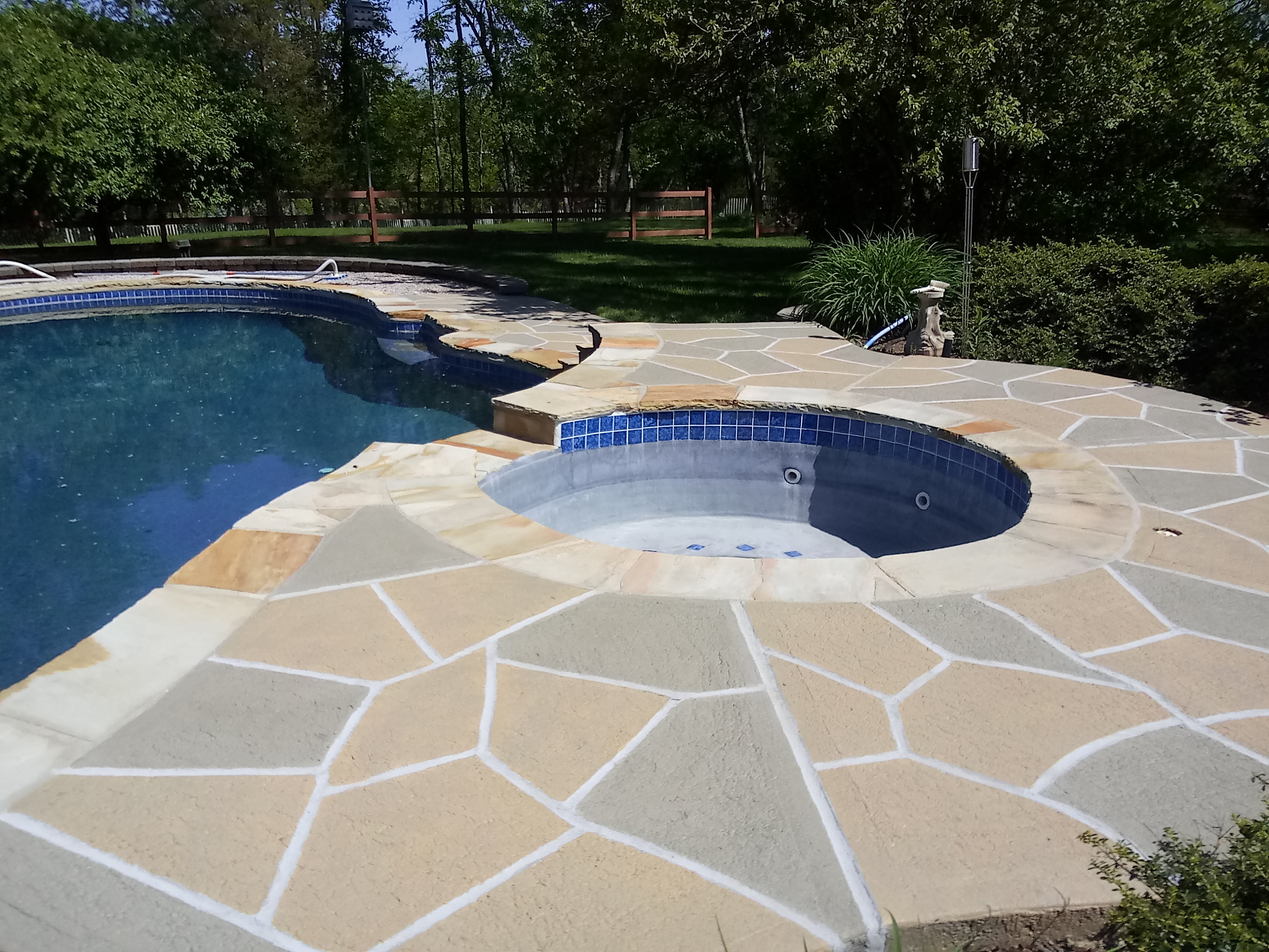 Pool deck resurfaced in Hurricane Slate finish with refined surface texture