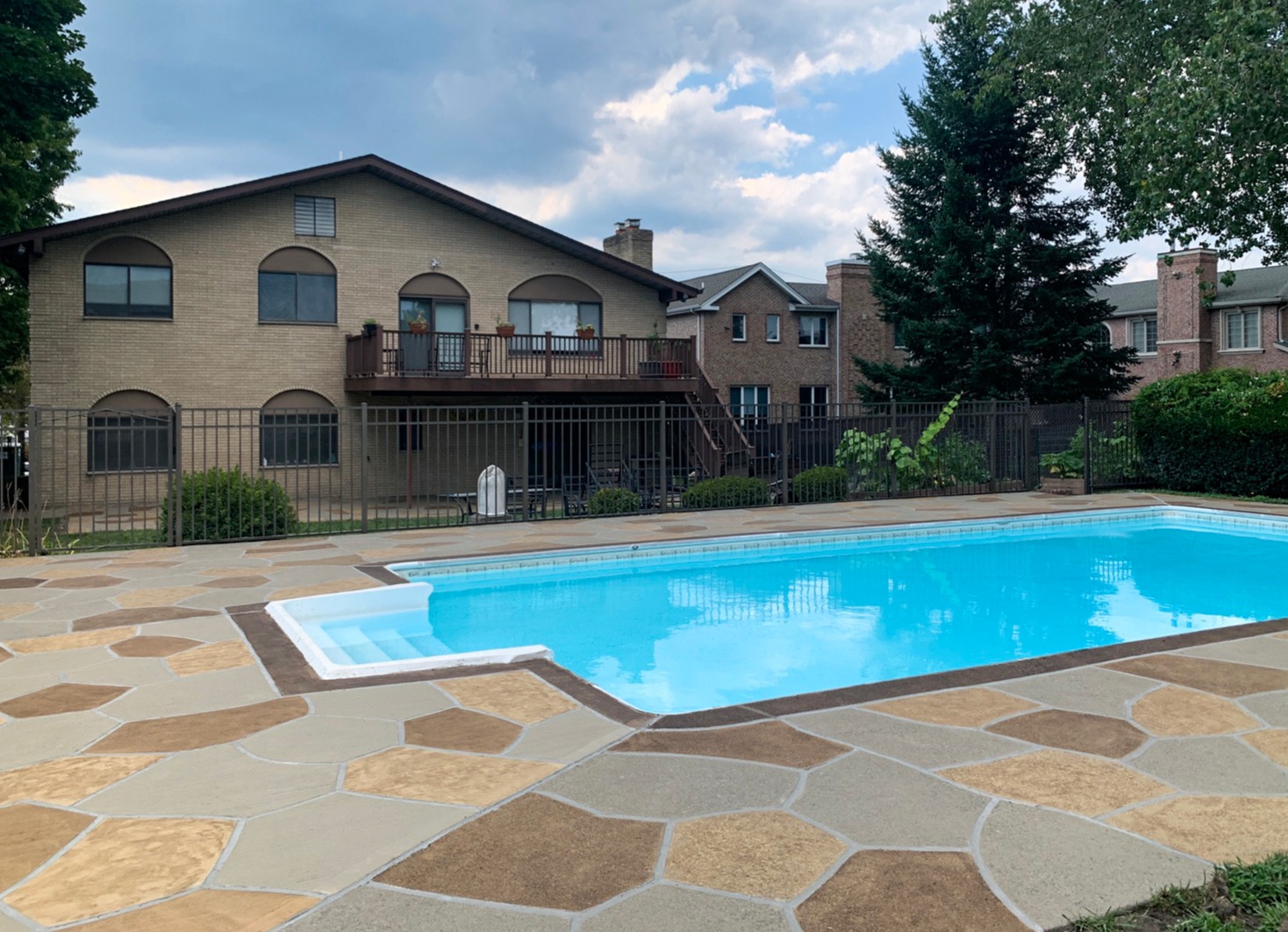 Pool deck resurfaced in Hurricane Slate finish with weathered slate appearance in Doylestown, PA