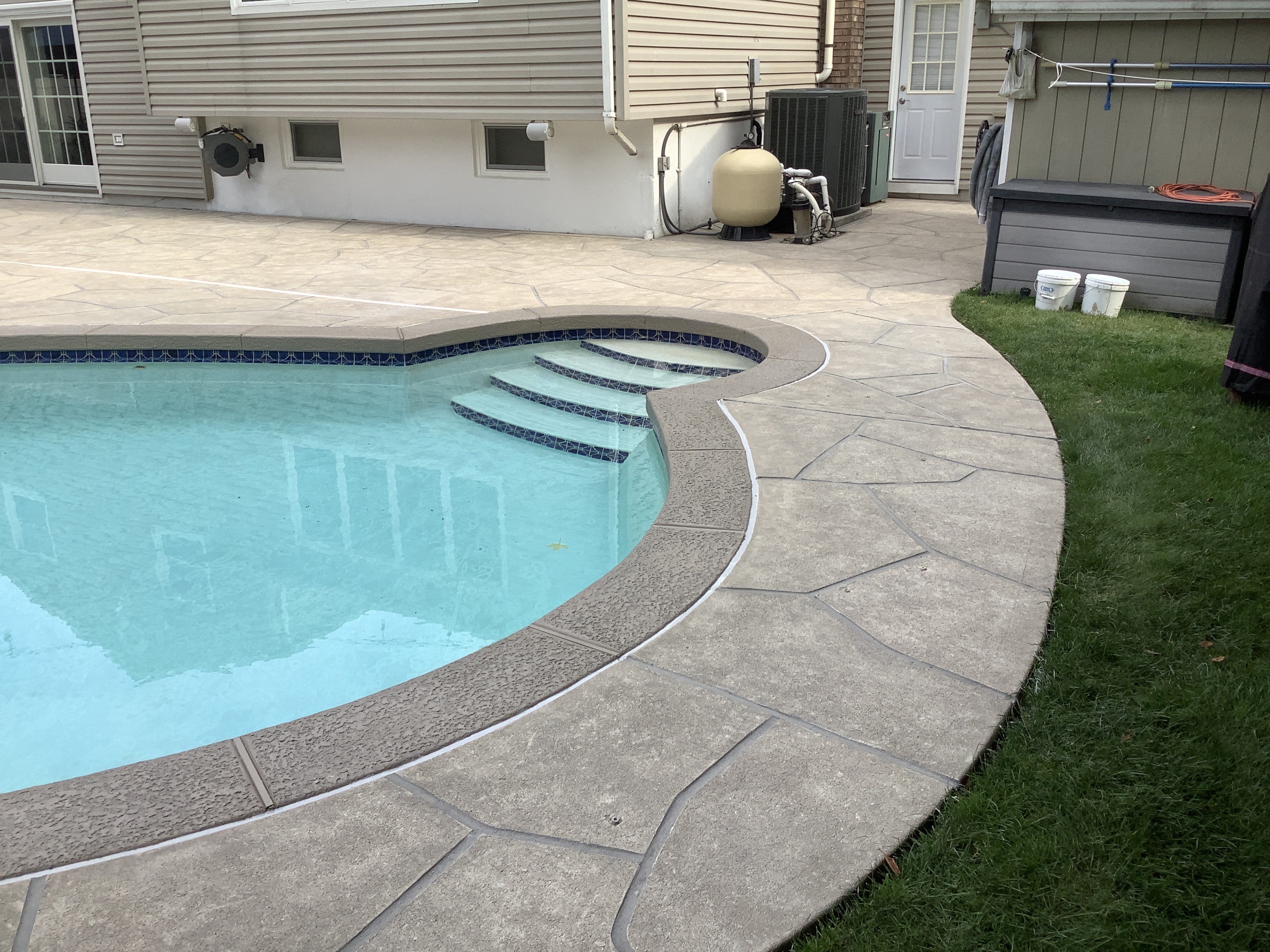 Sandstone concrete pool deck repair featuring natural sandstone appearance