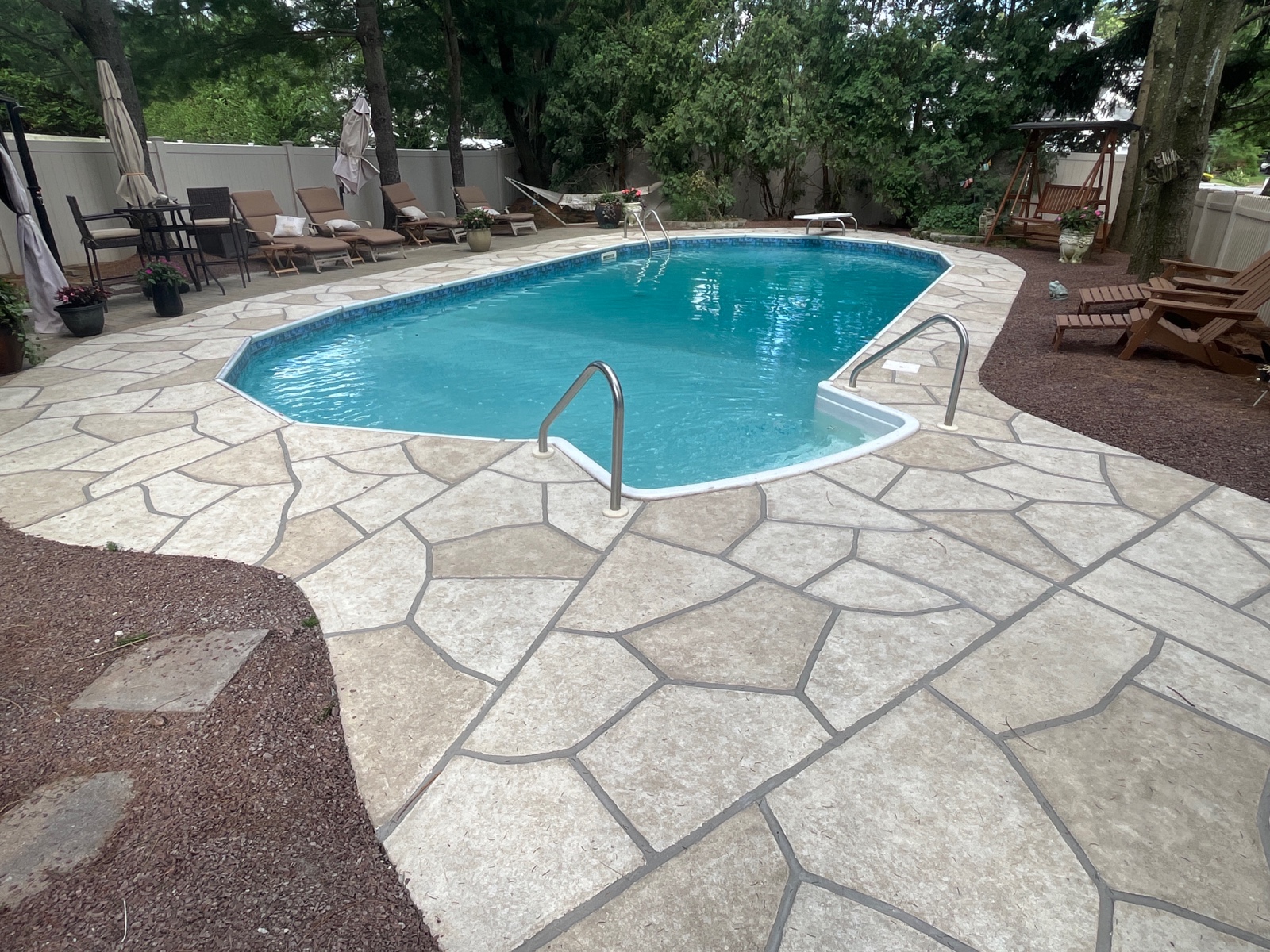 Pool deck resurfaced in Sandstone finish with natural sandstone appearance in Hartford, CT