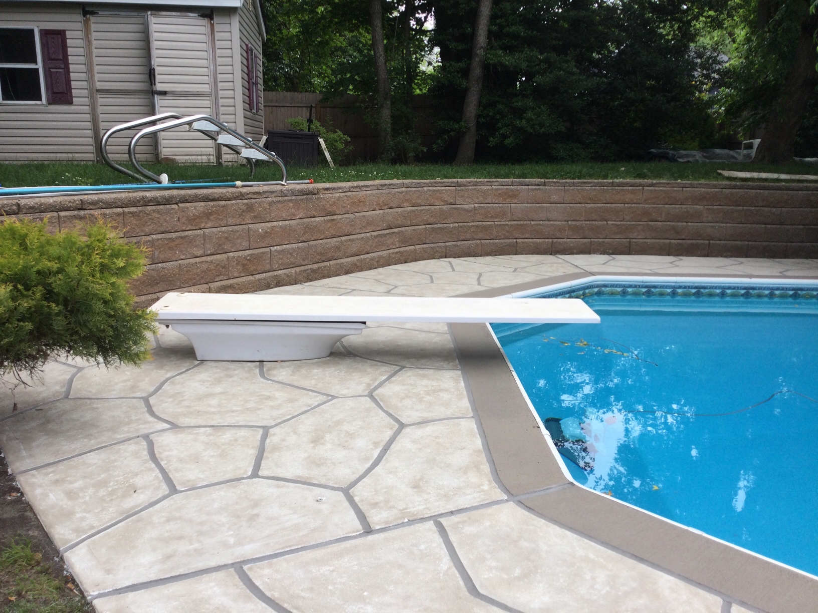 Warm-toned Sandstone pool deck renovation displaying durable resurfaced concrete in Allentown, PA