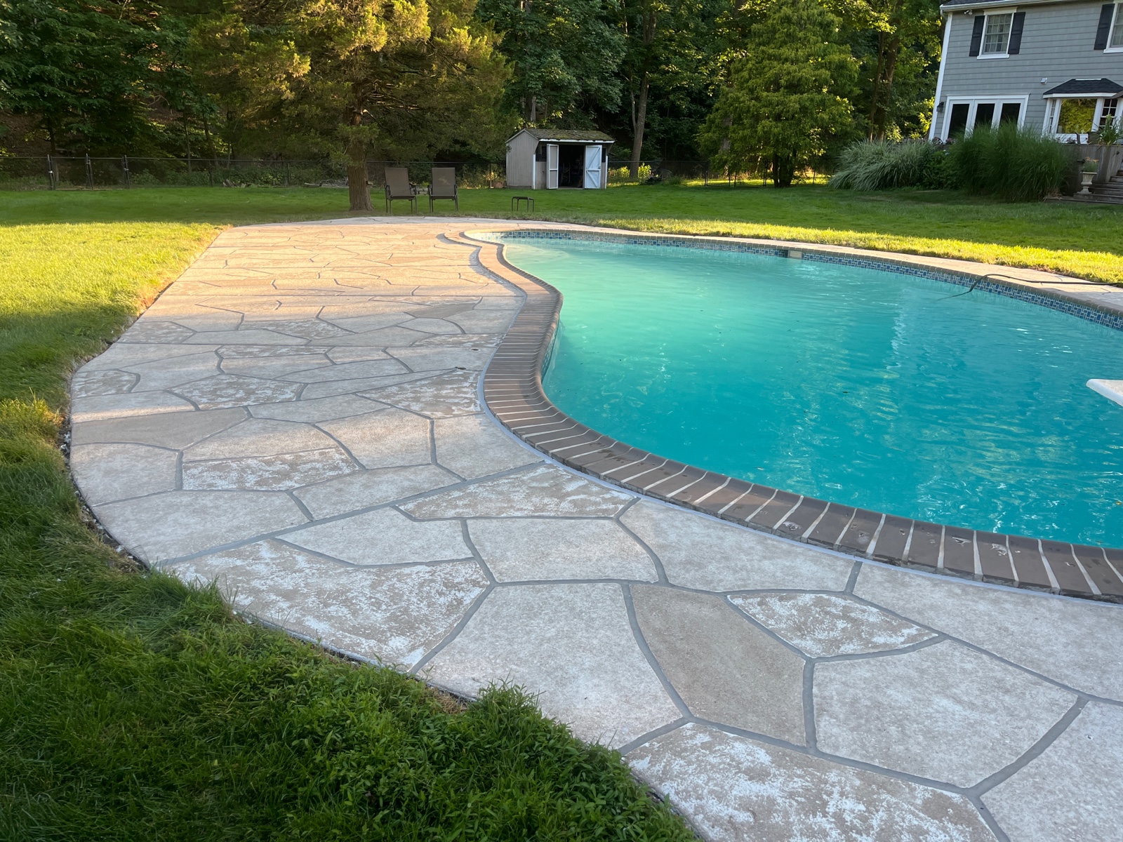 RenuKrete resurfaced pool deck in Sandstone showing natural sandstone appearance in Annapolis, MD