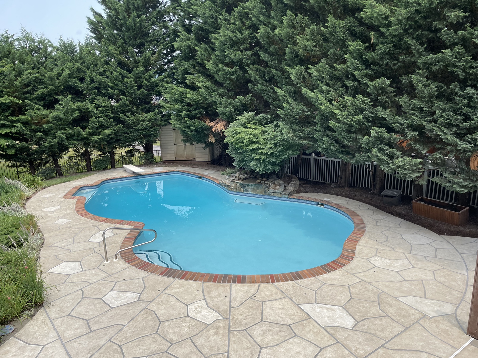 Warm-toned Sandstone pool deck renovation displaying natural sandstone appearance