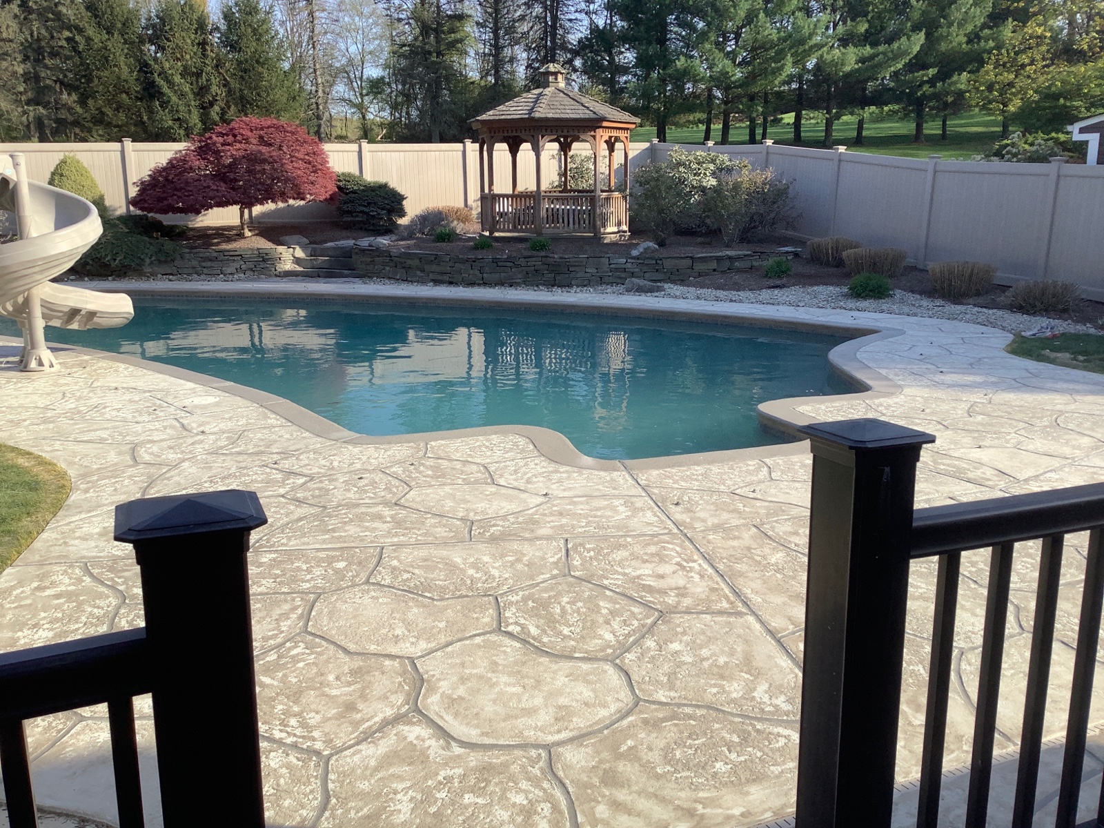 Warm-toned Sandstone pool deck renovation displaying soft stone-like texture