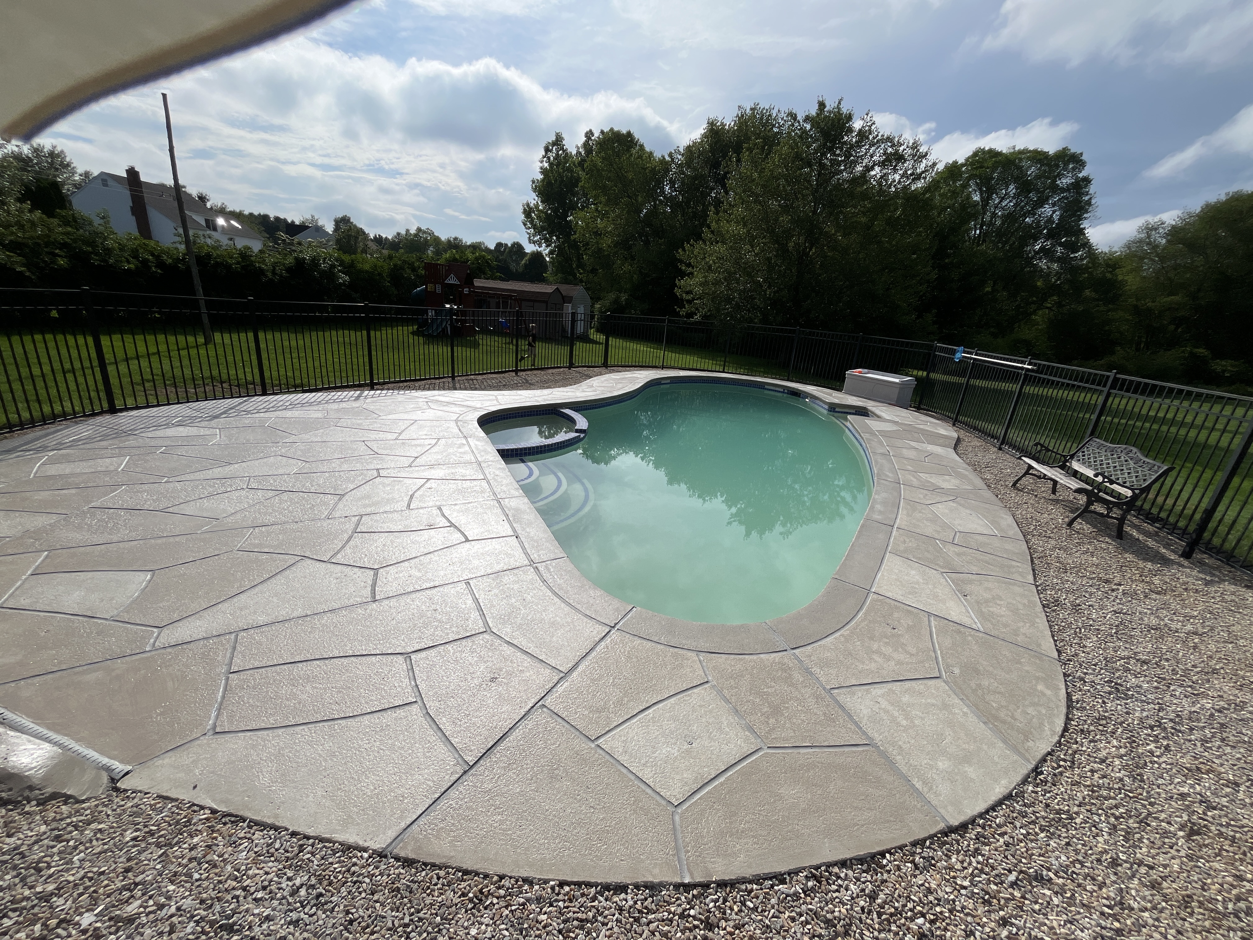 Sandstone concrete pool deck repair featuring natural sandstone appearance