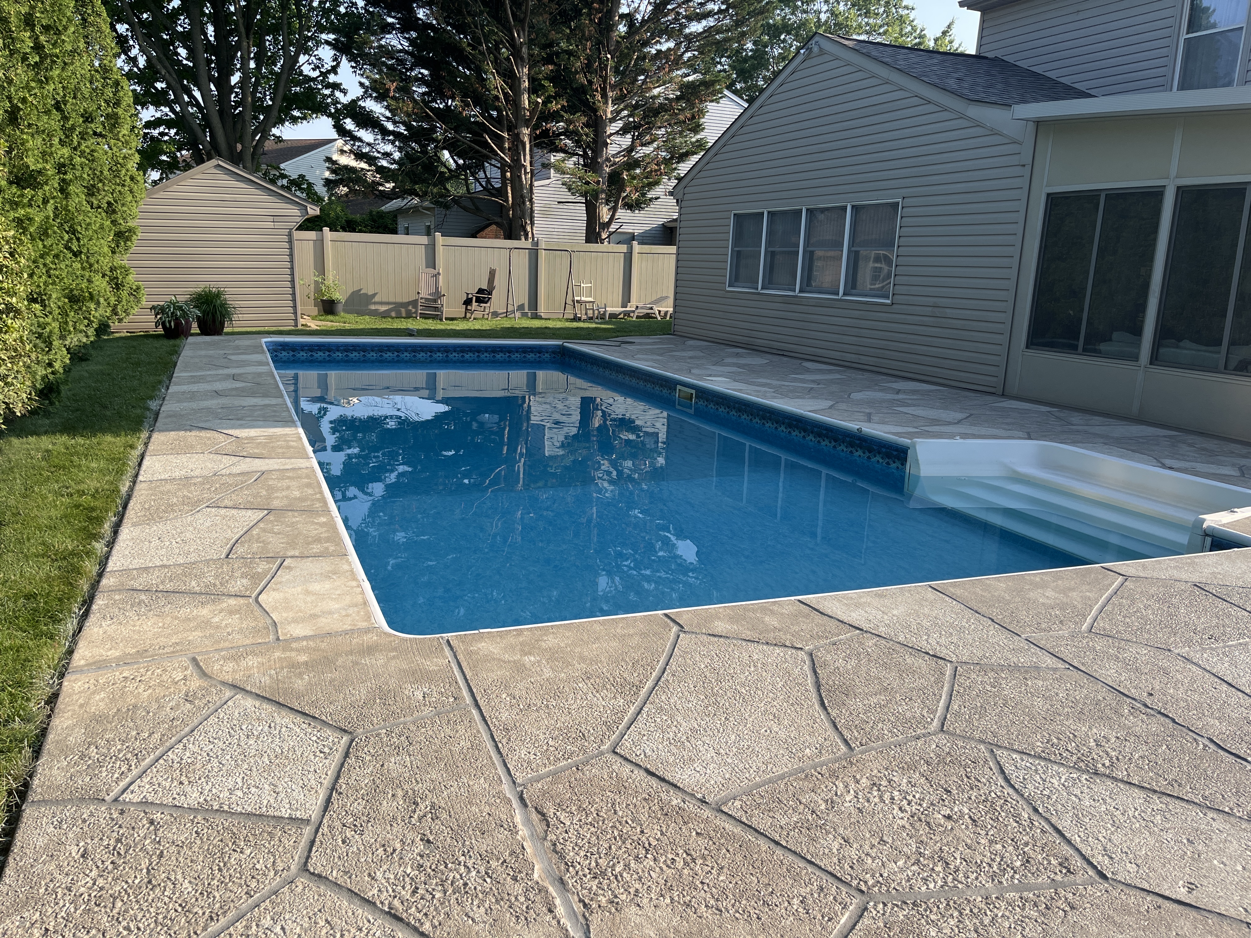 RenuKrete resurfaced pool deck in Sandstone showing subtle textured pattern in Hartford, CT