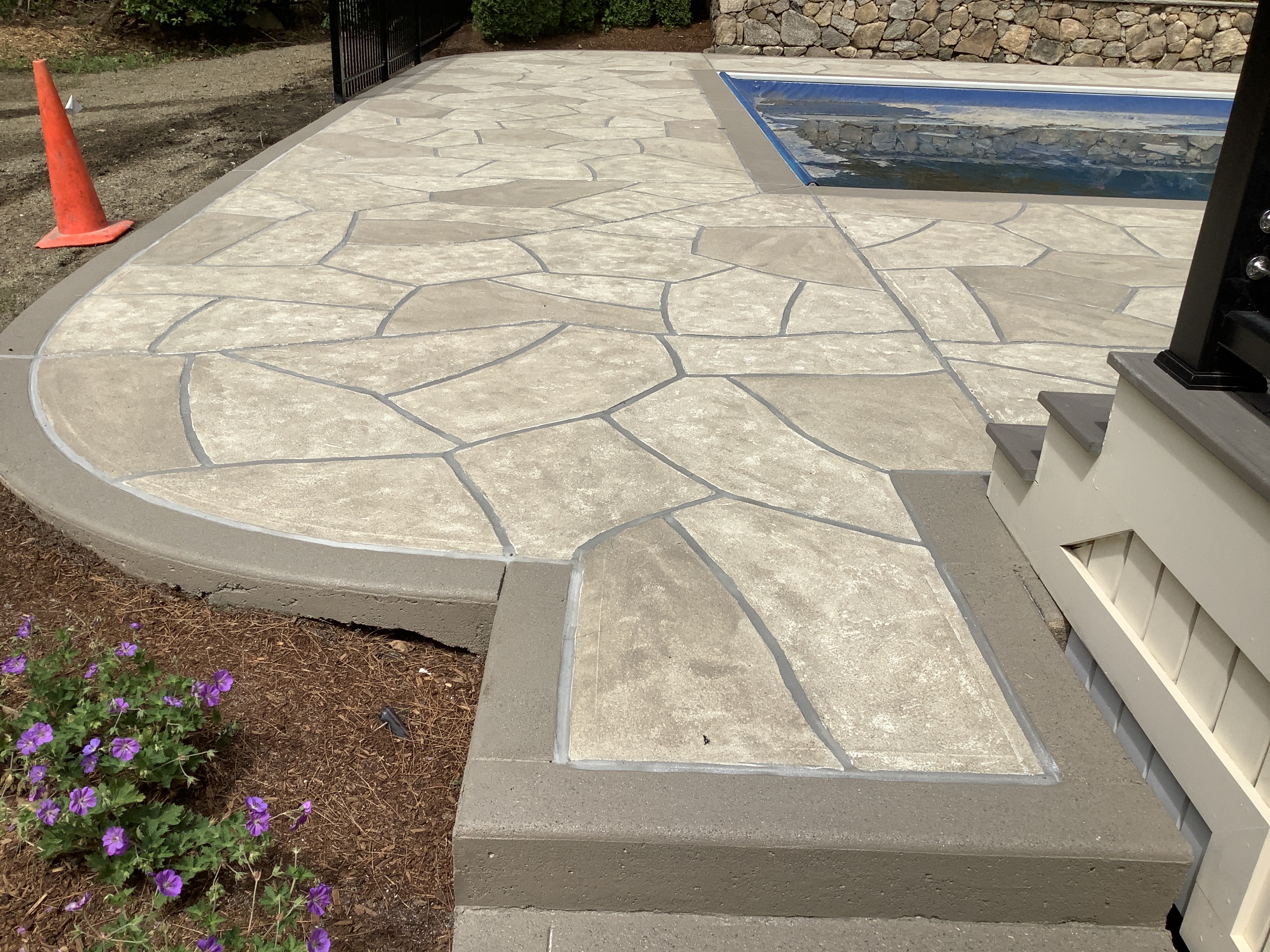Pool deck resurfaced in Sandstone finish with natural sandstone appearance