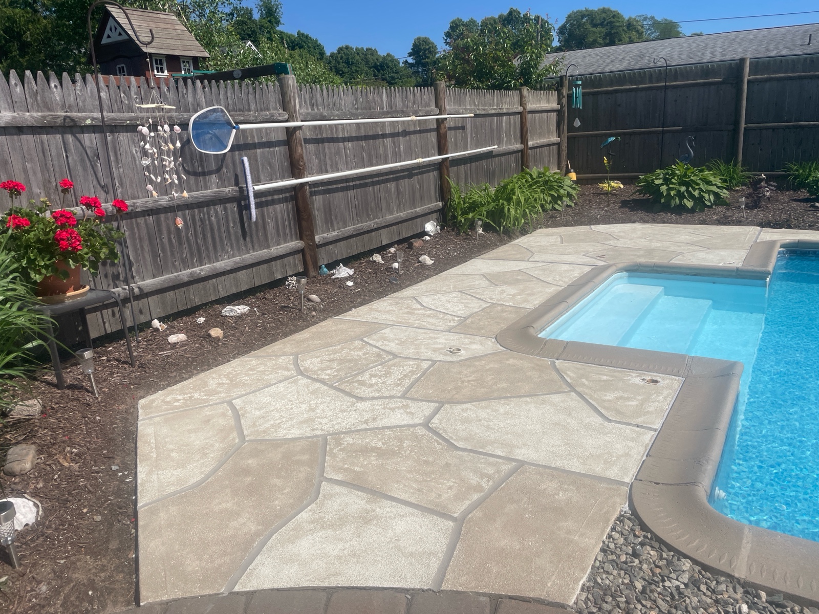 RenuKrete resurfaced pool deck in Sandstone showing soft stone-like texture