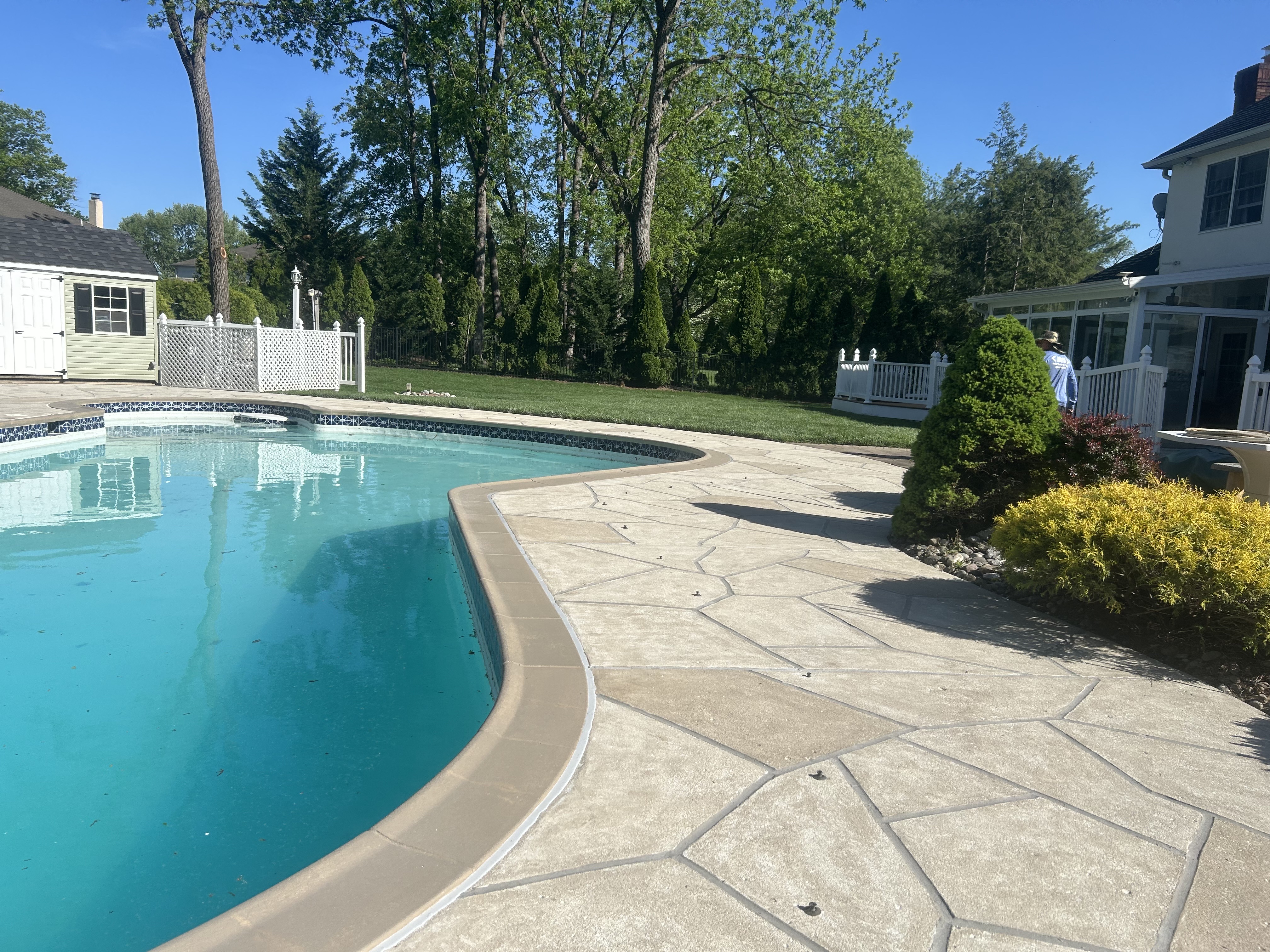 Sandstone concrete pool deck repair featuring warm earth-tone surface