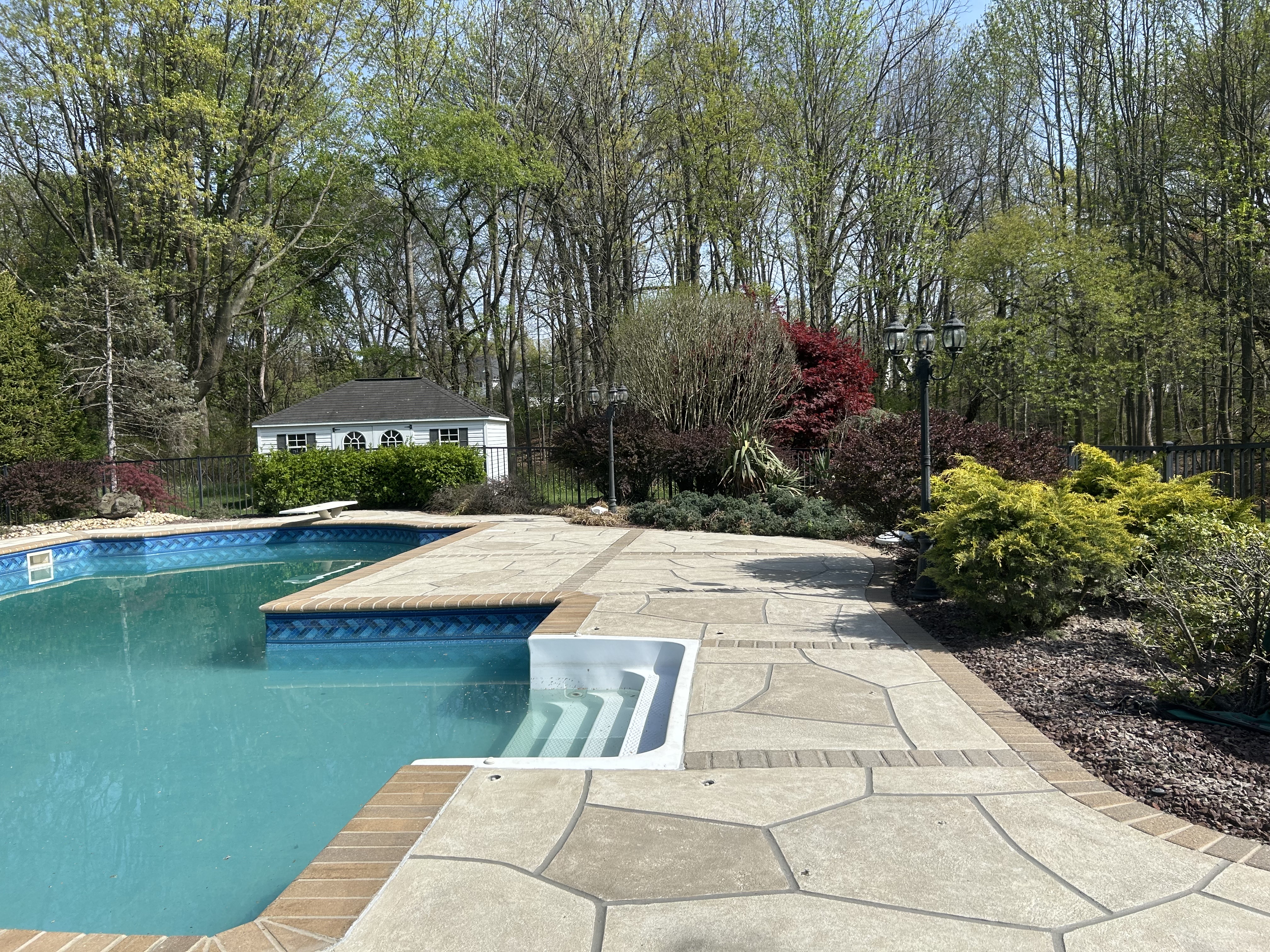 RenuKrete resurfaced pool deck in Sandstone showing durable resurfaced concrete in Hartford, CT