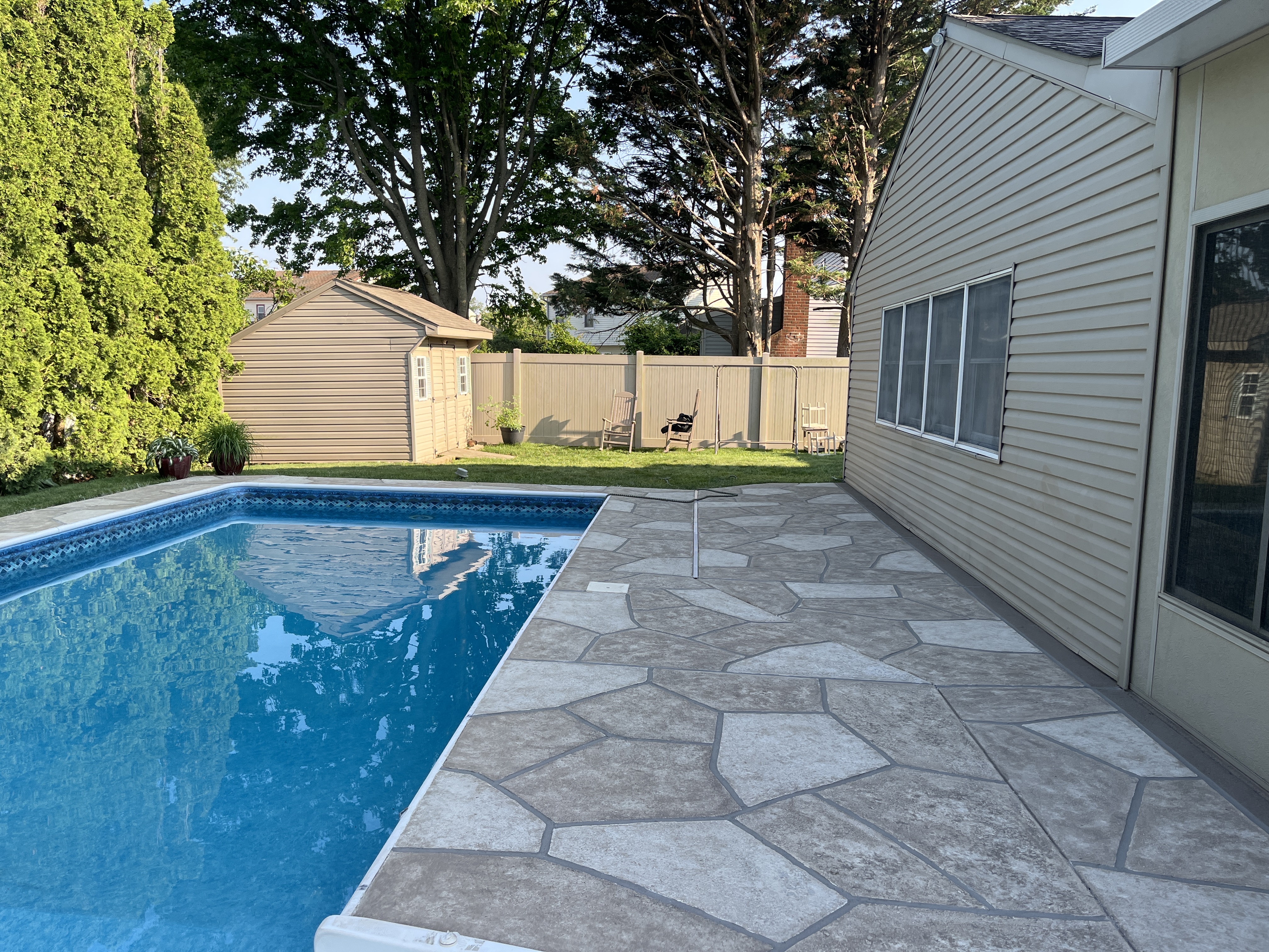 Pool deck resurfaced in Sandstone finish with natural sandstone appearance in Hartford, CT