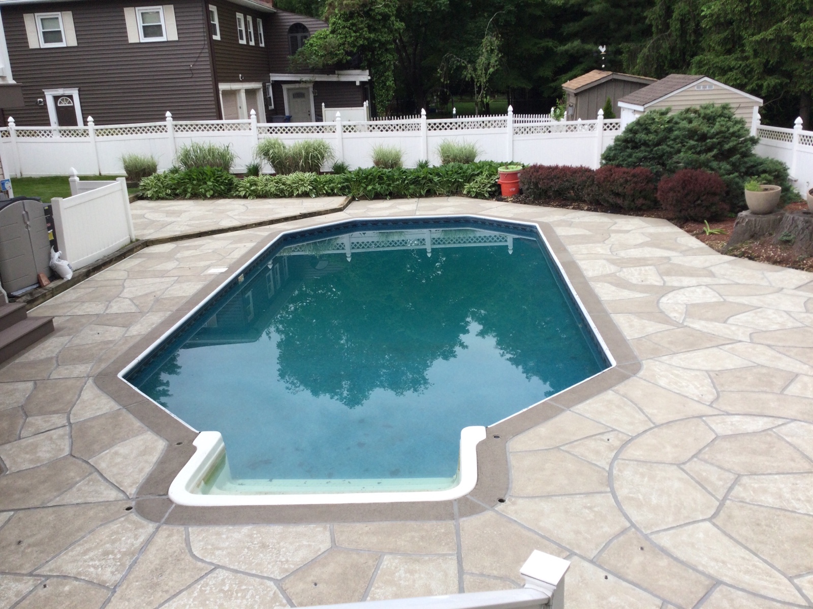RenuKrete resurfaced pool deck in Sandstone showing subtle textured pattern in Rockville, MD