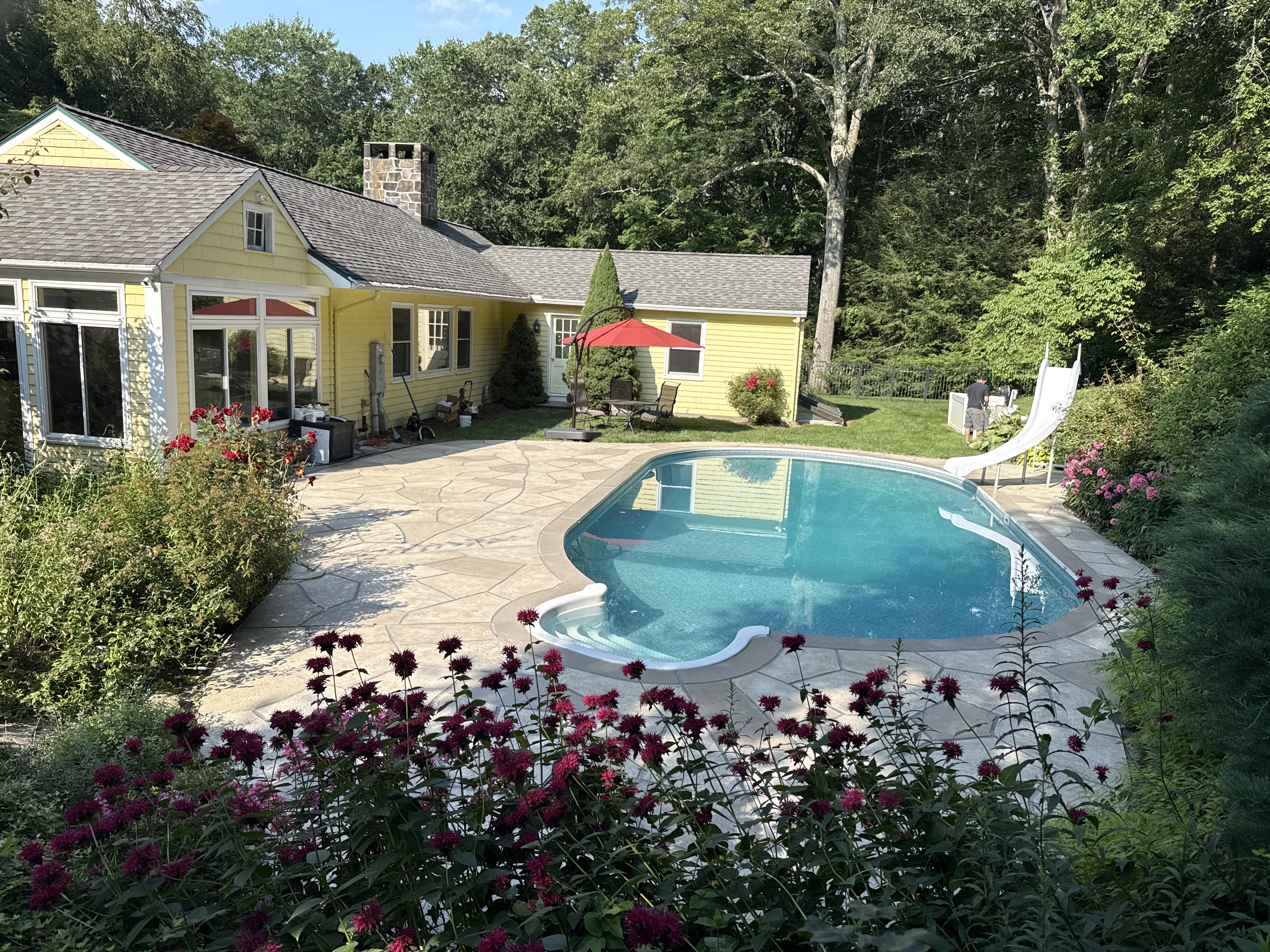 RenuKrete resurfaced pool deck in Sandstone showing durable resurfaced concrete in Stamford, CT