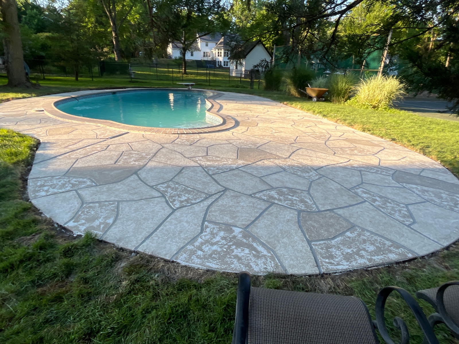 Sandstone concrete pool deck repair featuring soft stone-like texture