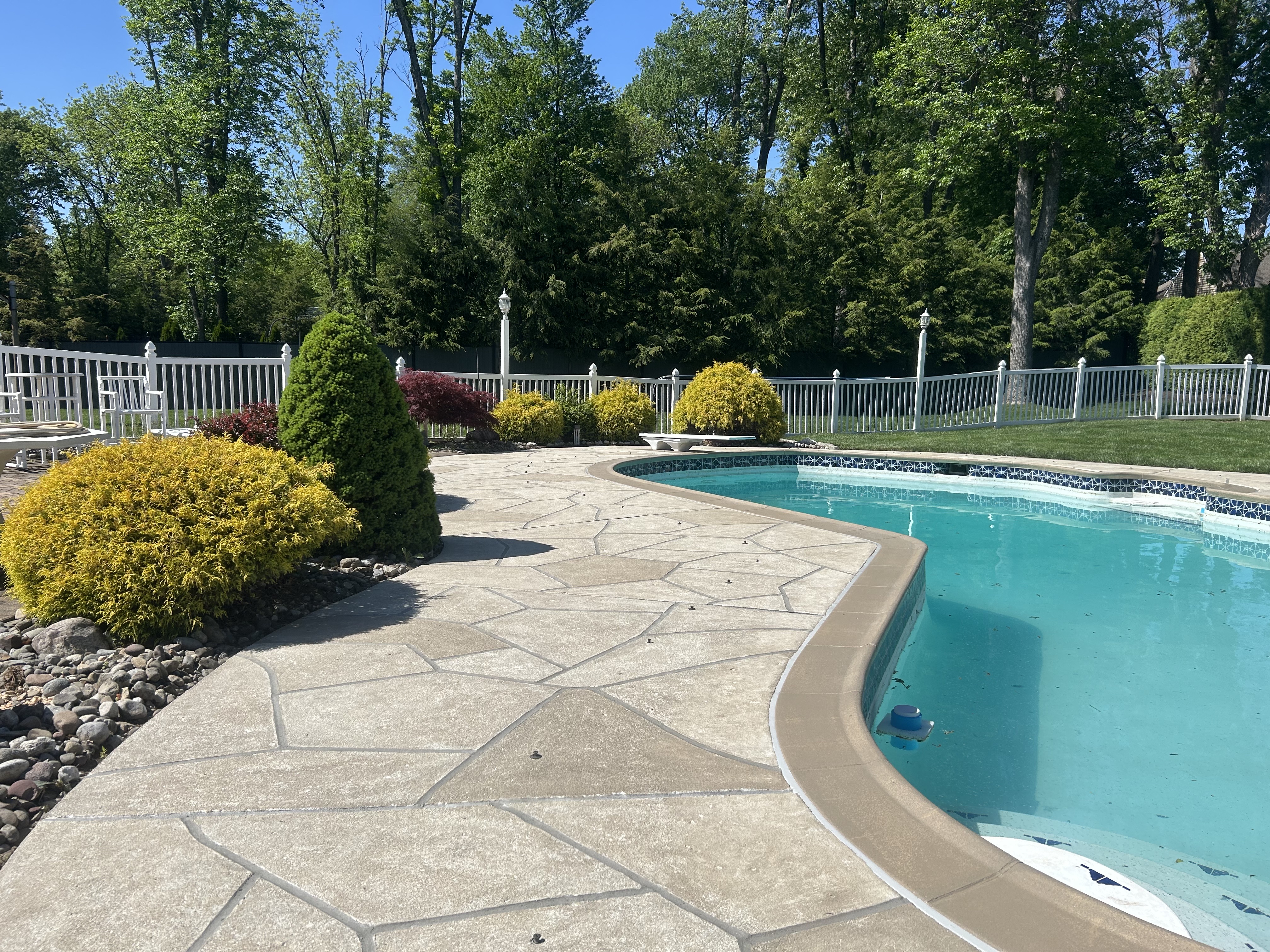 RenuKrete resurfaced pool deck in Sandstone showing subtle textured pattern