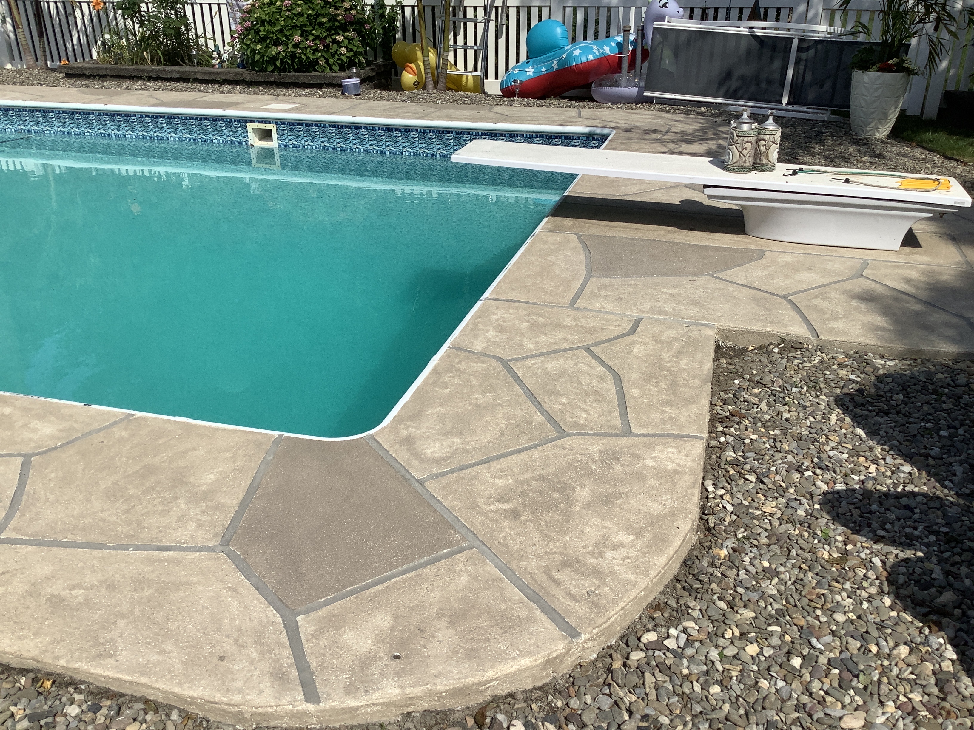 RenuKrete resurfaced pool deck in Sandstone showing subtle textured pattern in Rockville, MD
