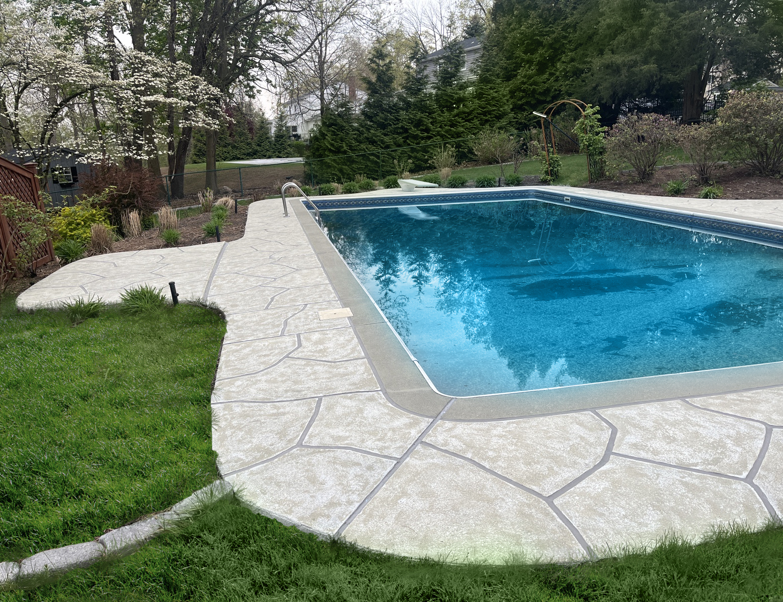 Sandstone concrete pool deck repair featuring subtle textured pattern