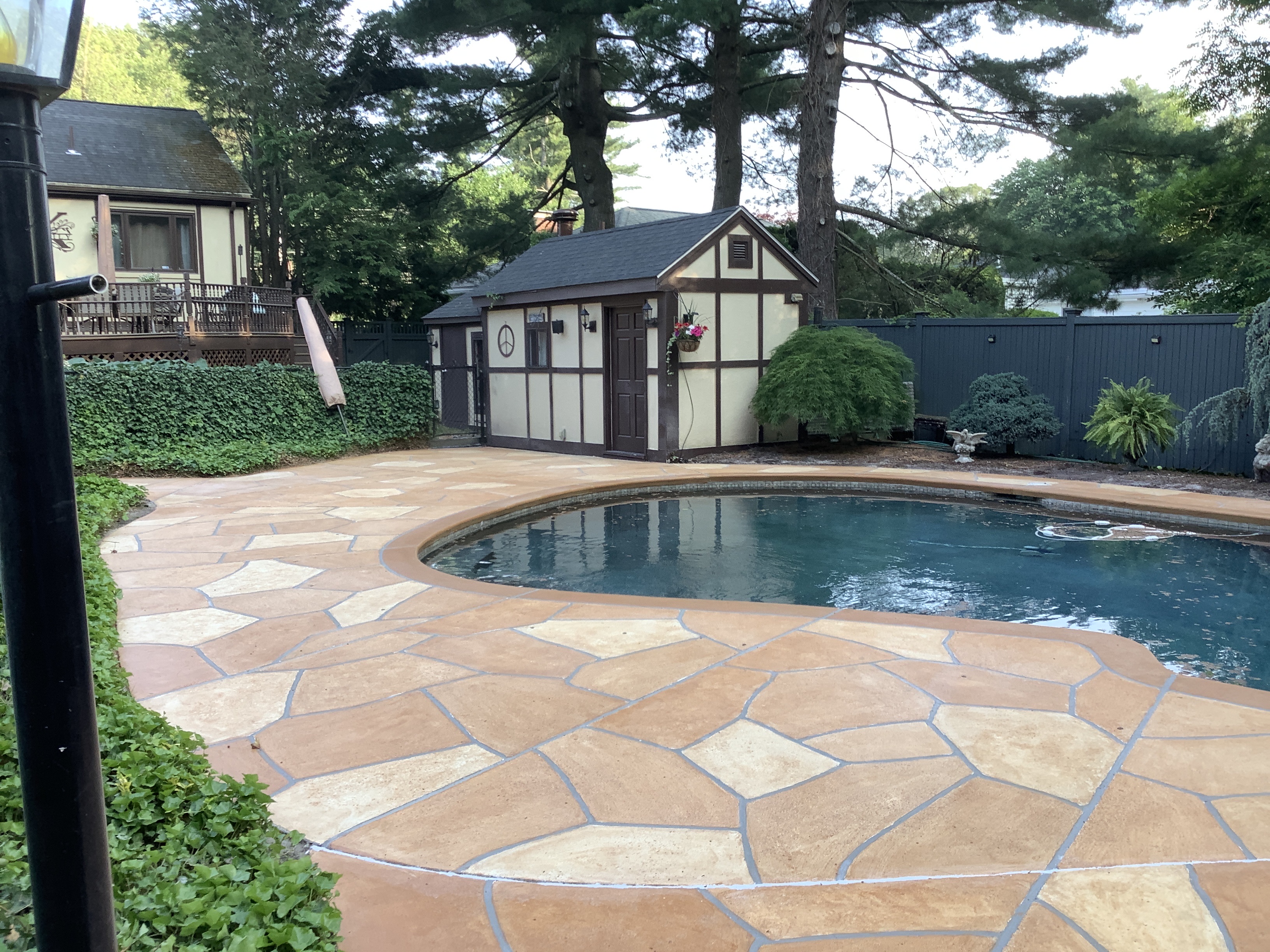 RenuKrete Tuscany-style resurfaced pool deck featuring enhanced aesthetic detail