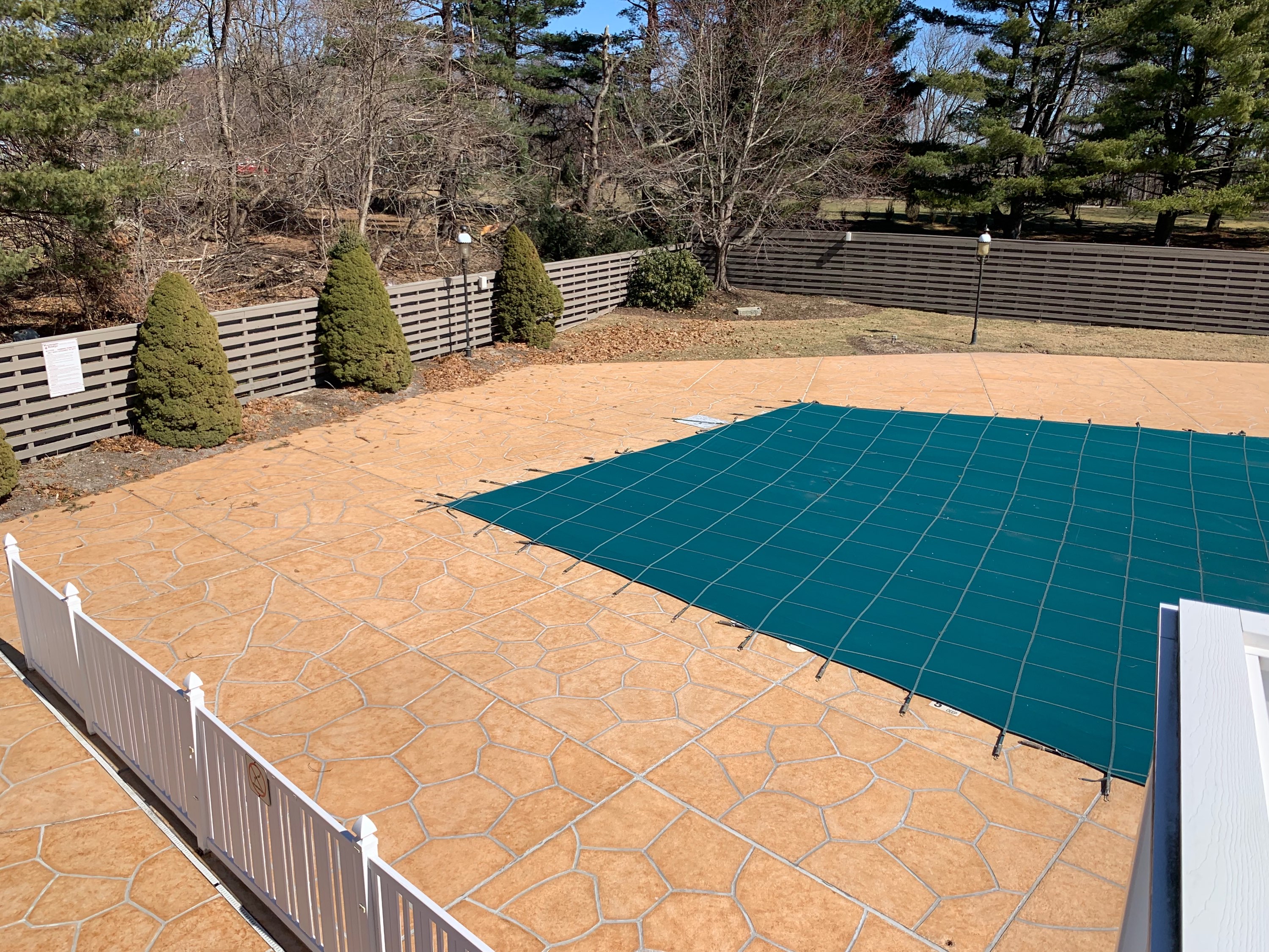 Pool deck resurfaced in Tuscany finish showing natural Mediterranean coloring