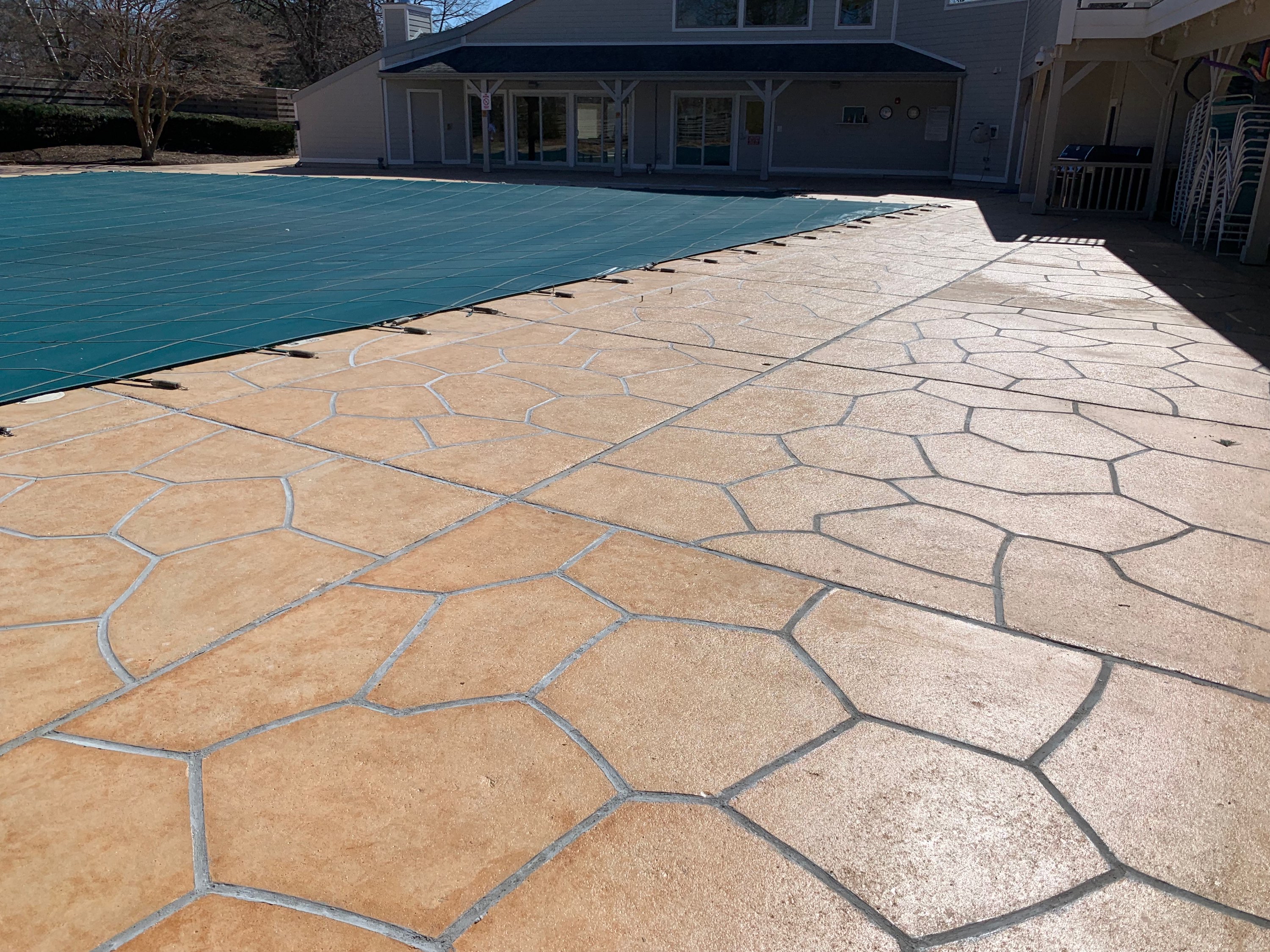 RenuKrete Tuscany-style resurfaced pool deck featuring durable resurfaced concrete in Princeton, NJ