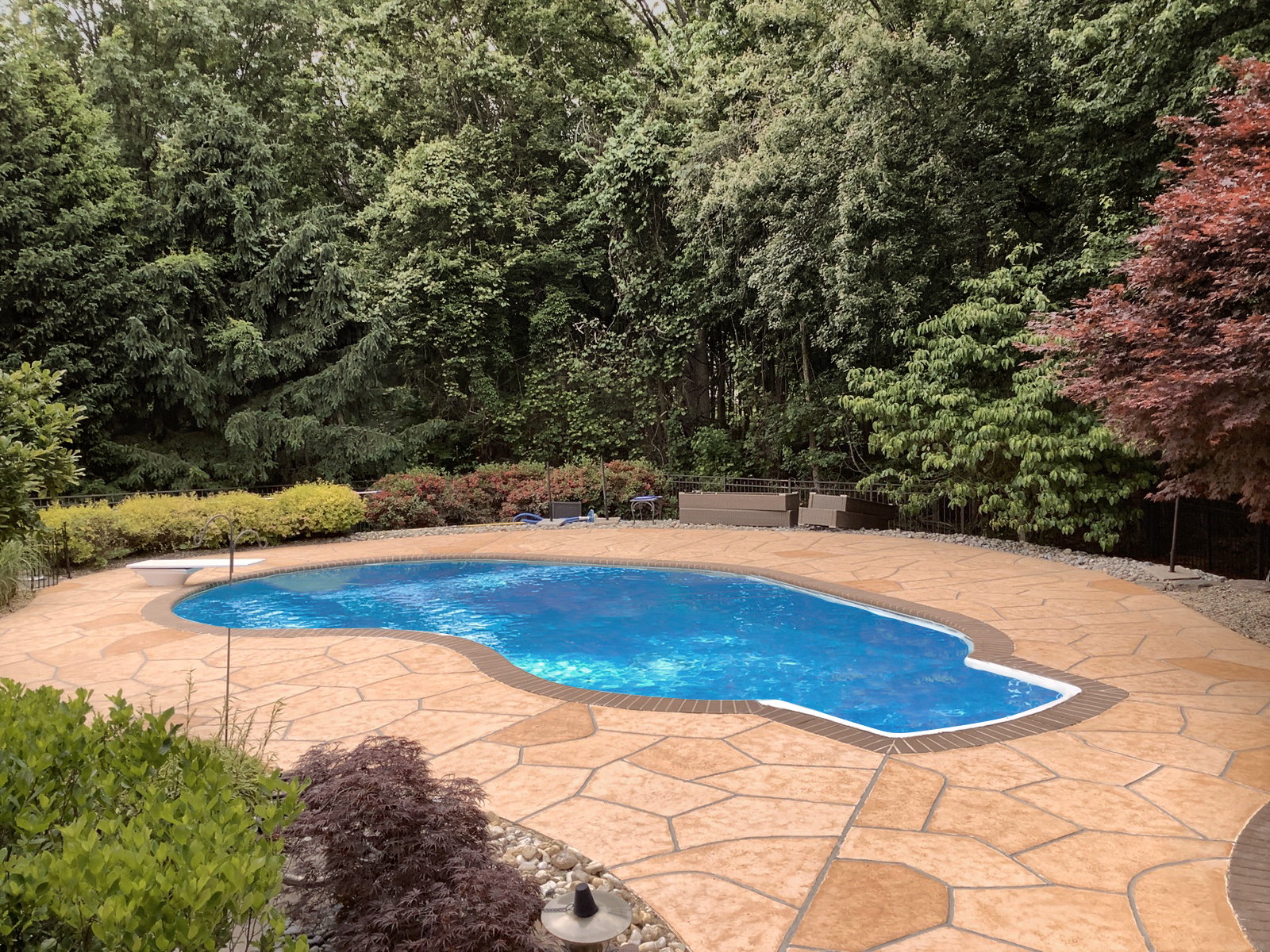 Pool deck resurfaced in Tuscany finish showing subtle textured surface
