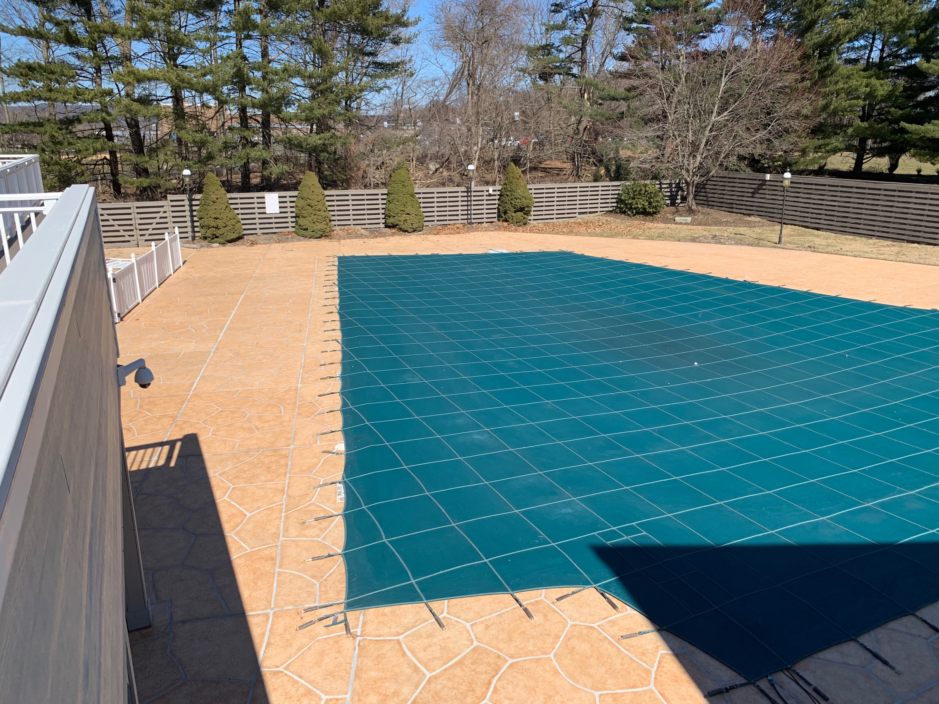 Pool deck resurfaced in Tuscany finish showing durable resurfaced concrete