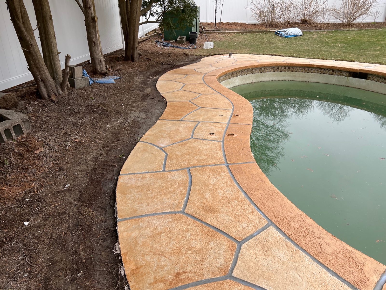 Pool deck resurfaced in Tuscany finish showing subtle textured surface