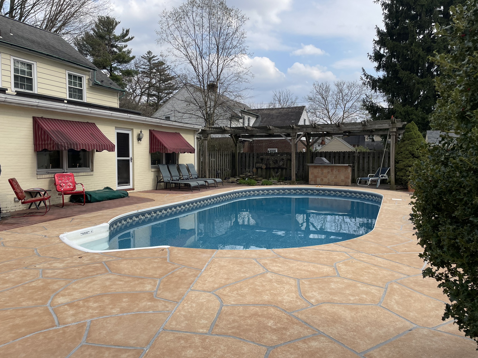 Tuscany concrete pool deck repair with warm earth tones