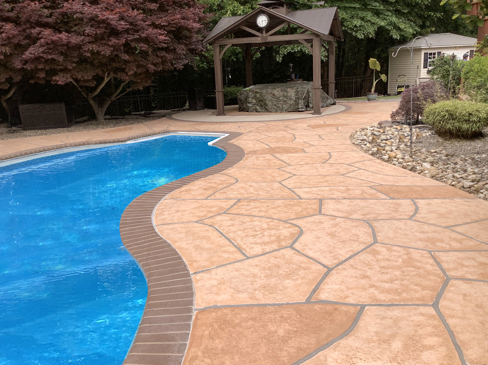 Tuscany concrete pool deck repair with warm earth tones
