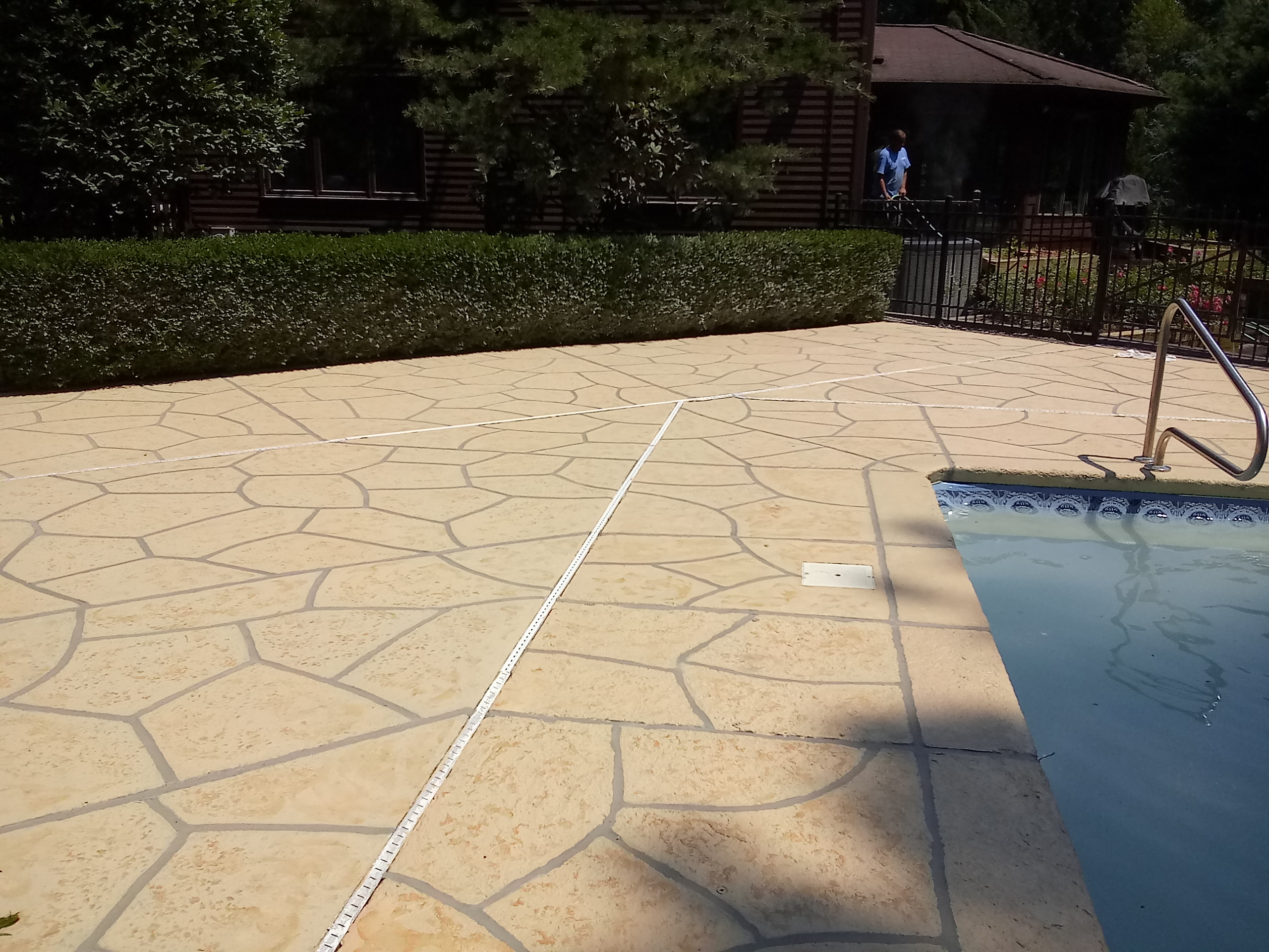 RenuKrete Tuscany-style resurfaced pool deck featuring natural Mediterranean coloring