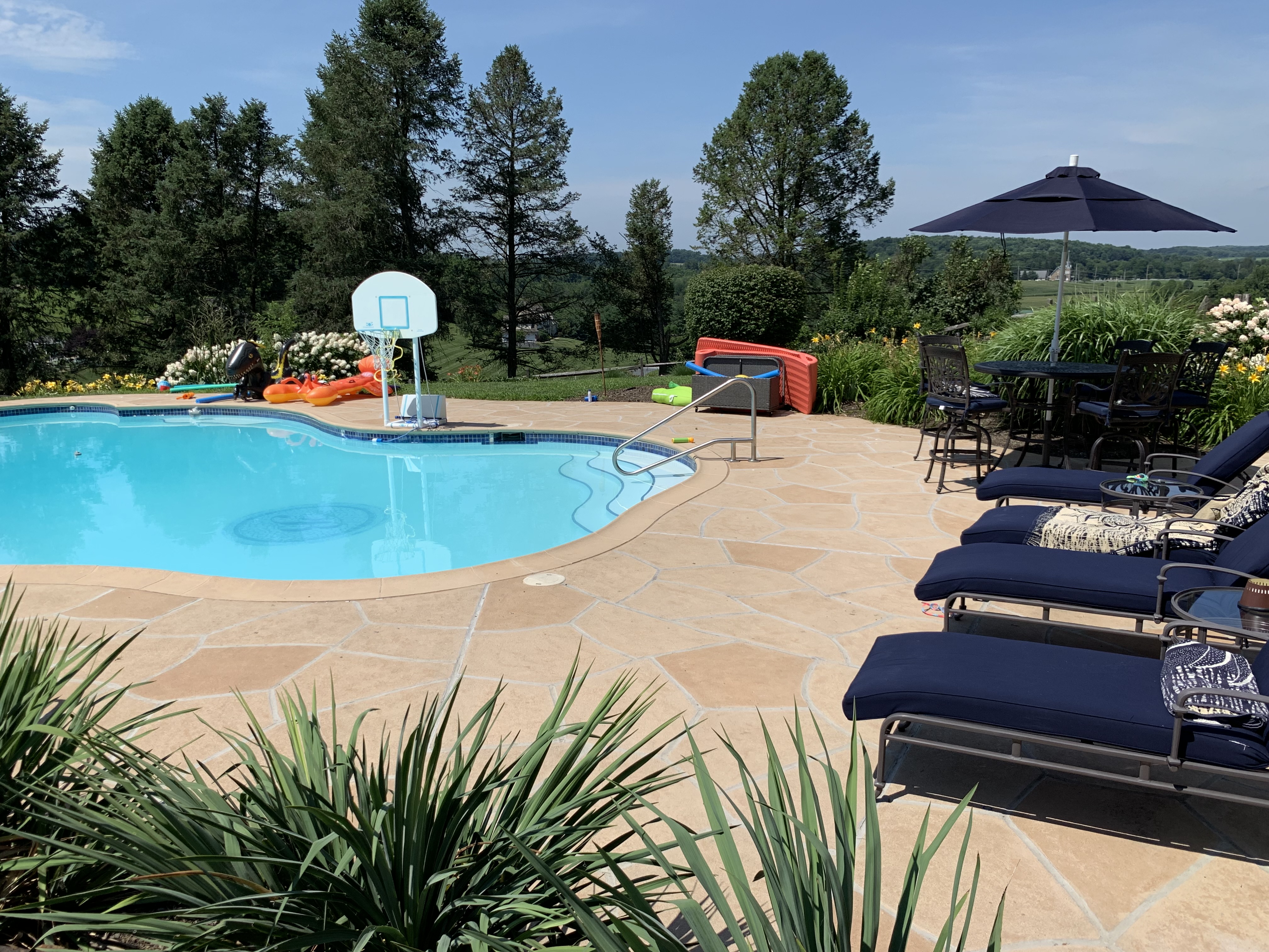 Pool deck resurfaced in Tuscany finish showing natural Mediterranean coloring