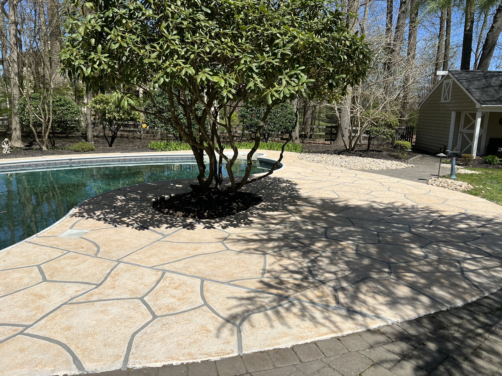 RenuKrete Tuscany-style resurfaced pool deck featuring subtle textured surface in Warwick, RI