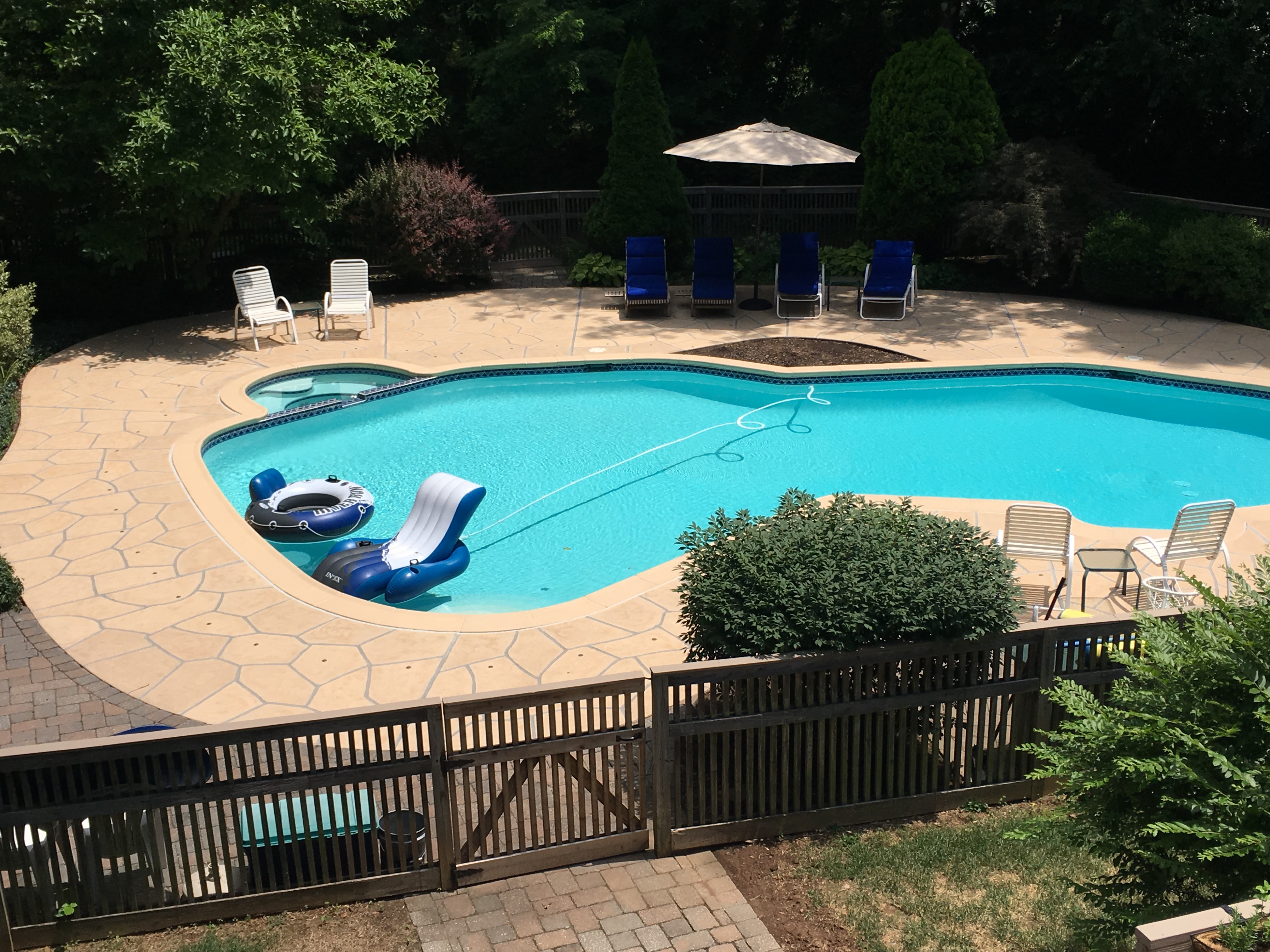 RenuKrete Tuscany-style resurfaced pool deck featuring stone-like texture