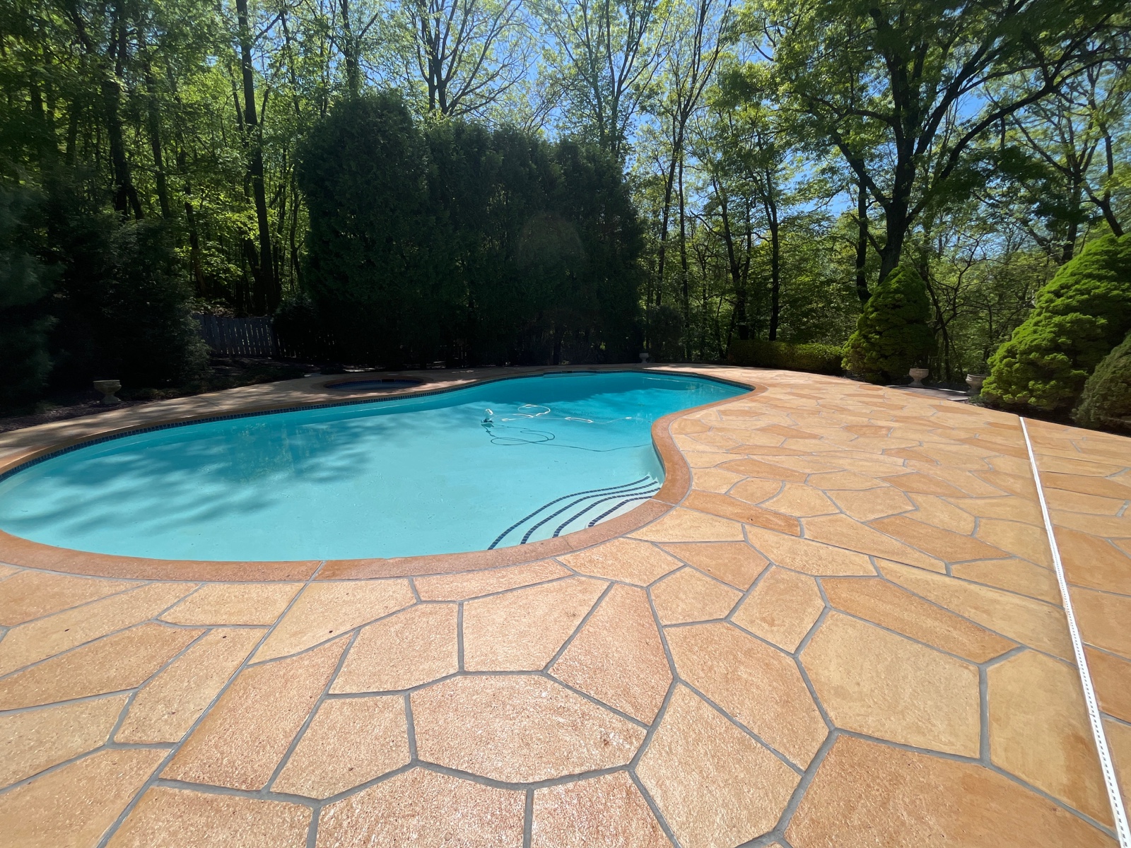 Tuscany concrete pool deck repair with stone-like texture