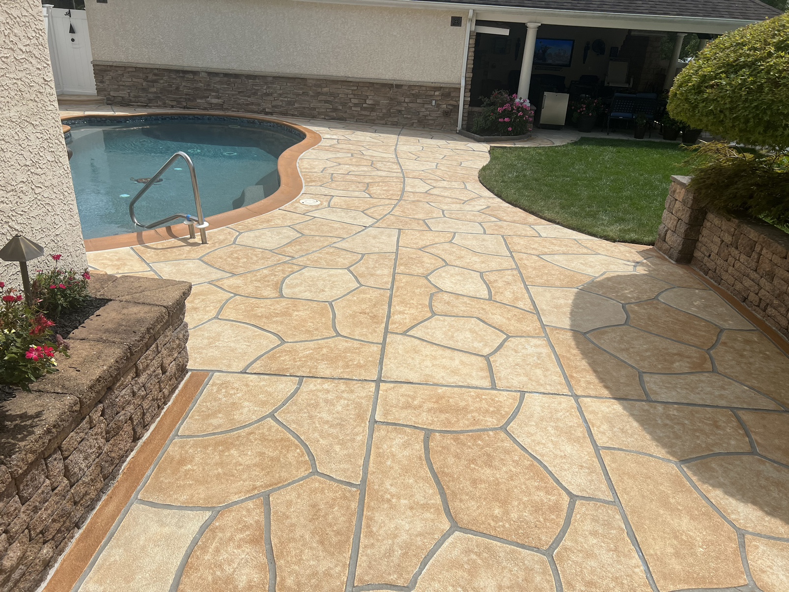 Pool deck resurfaced in Tuscany finish showing subtle textured surface